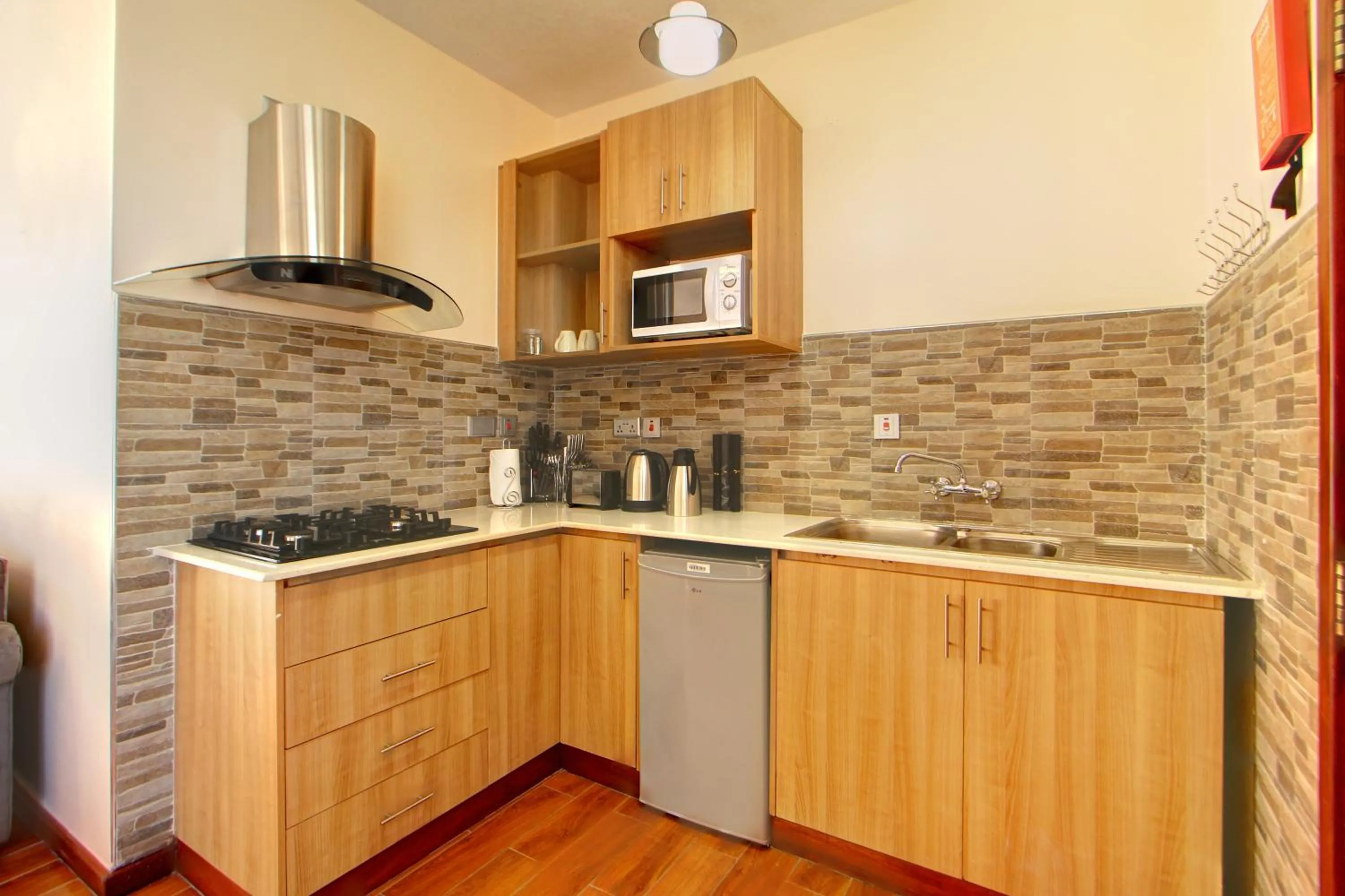 Kitchen or kitchenette in Highlands Suites Hotel Apartments