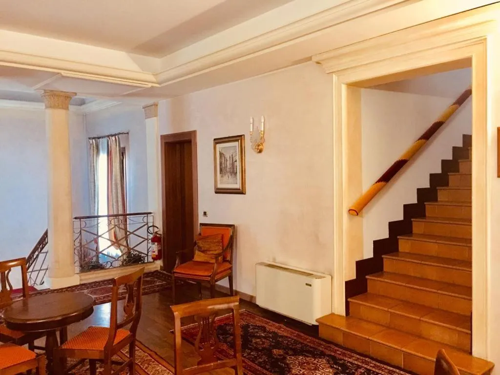 Communal lounge/ TV room in Hotel La Loggia