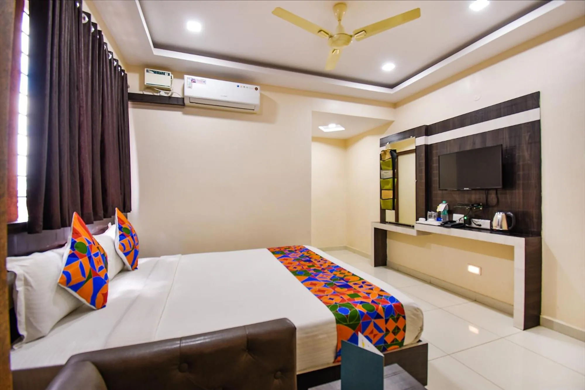Bed in FabHotel Rotano Suites - Yelahanka