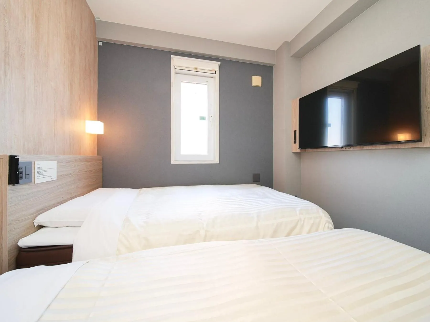 Bed in Super Hotel Hiroshima