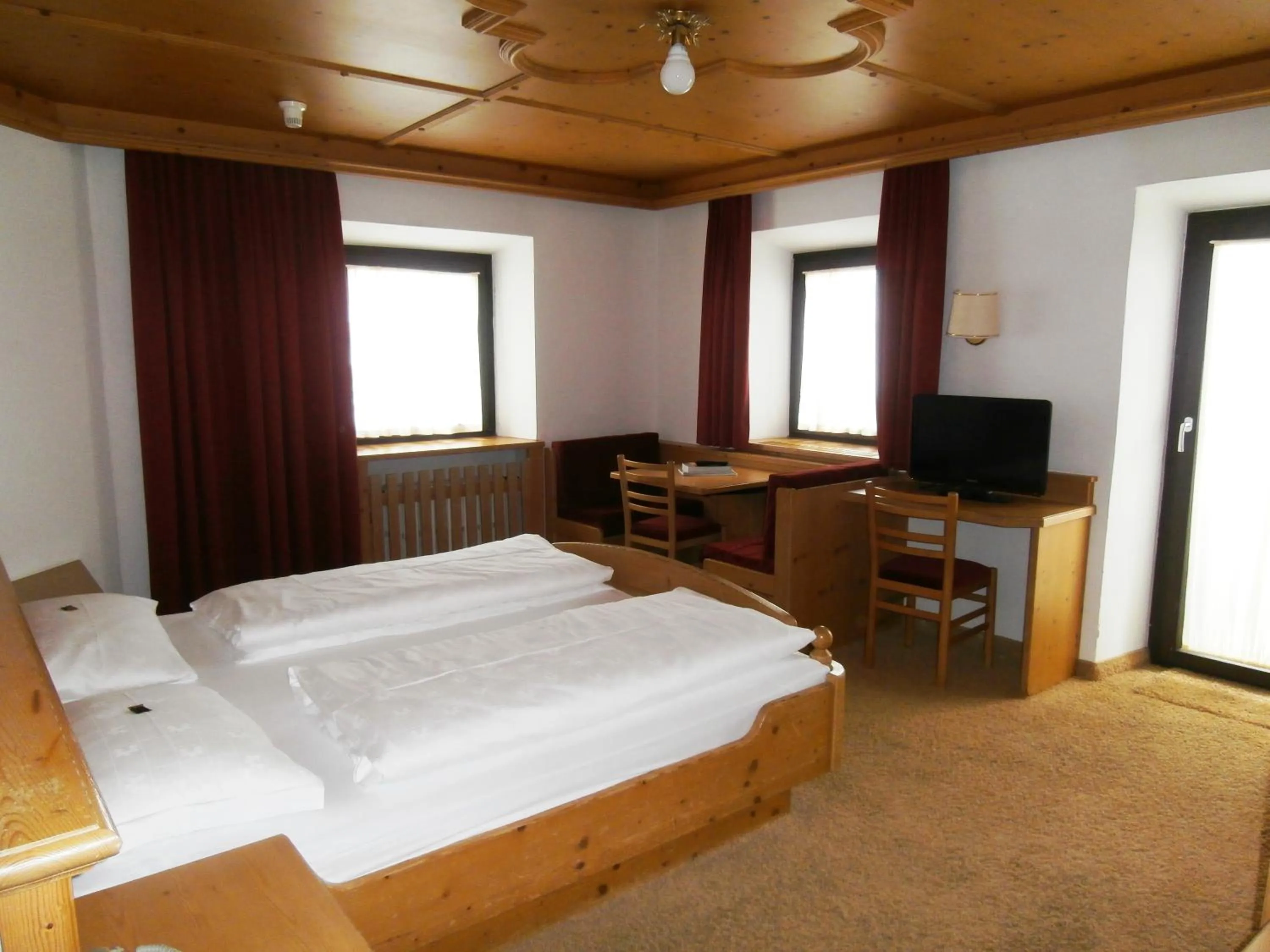 Bed in Piccolo Hotel Gurschler