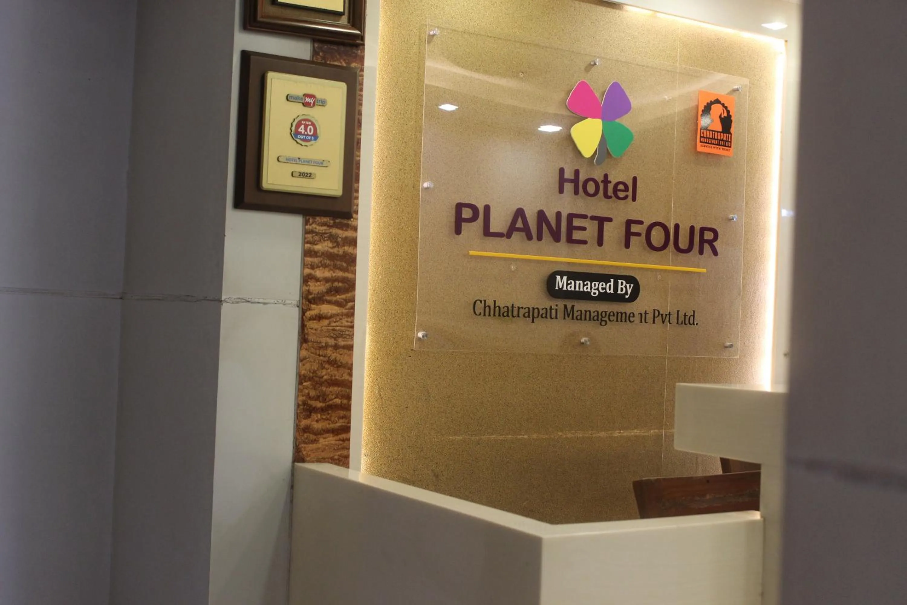 Property logo or sign in Hotel Planet Four