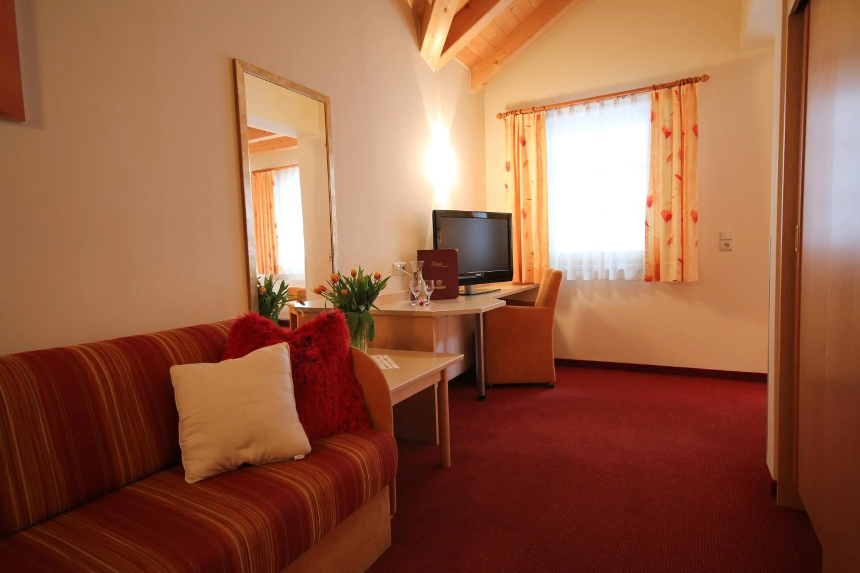 Seating area, Bed in Hotel Gasthof Neuner