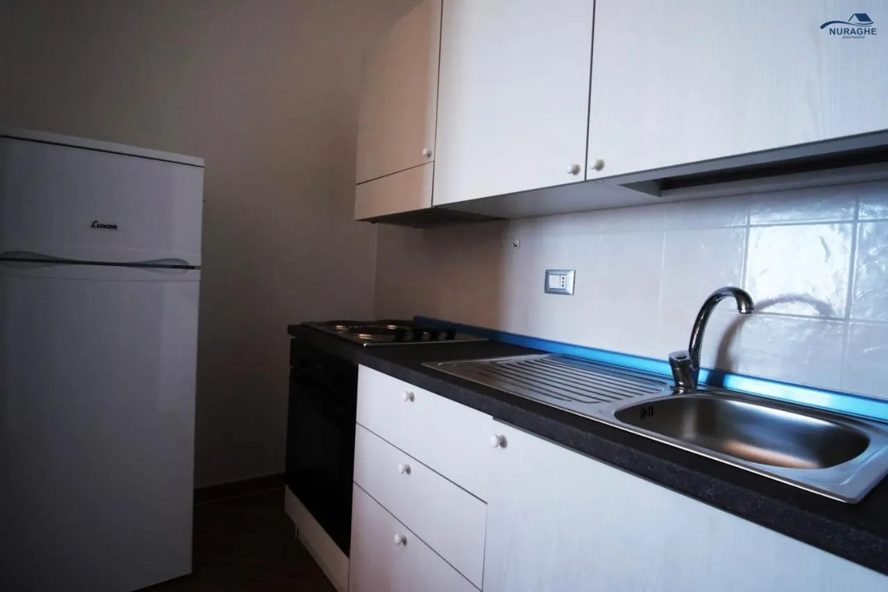kitchen in Nuraghe Apartments