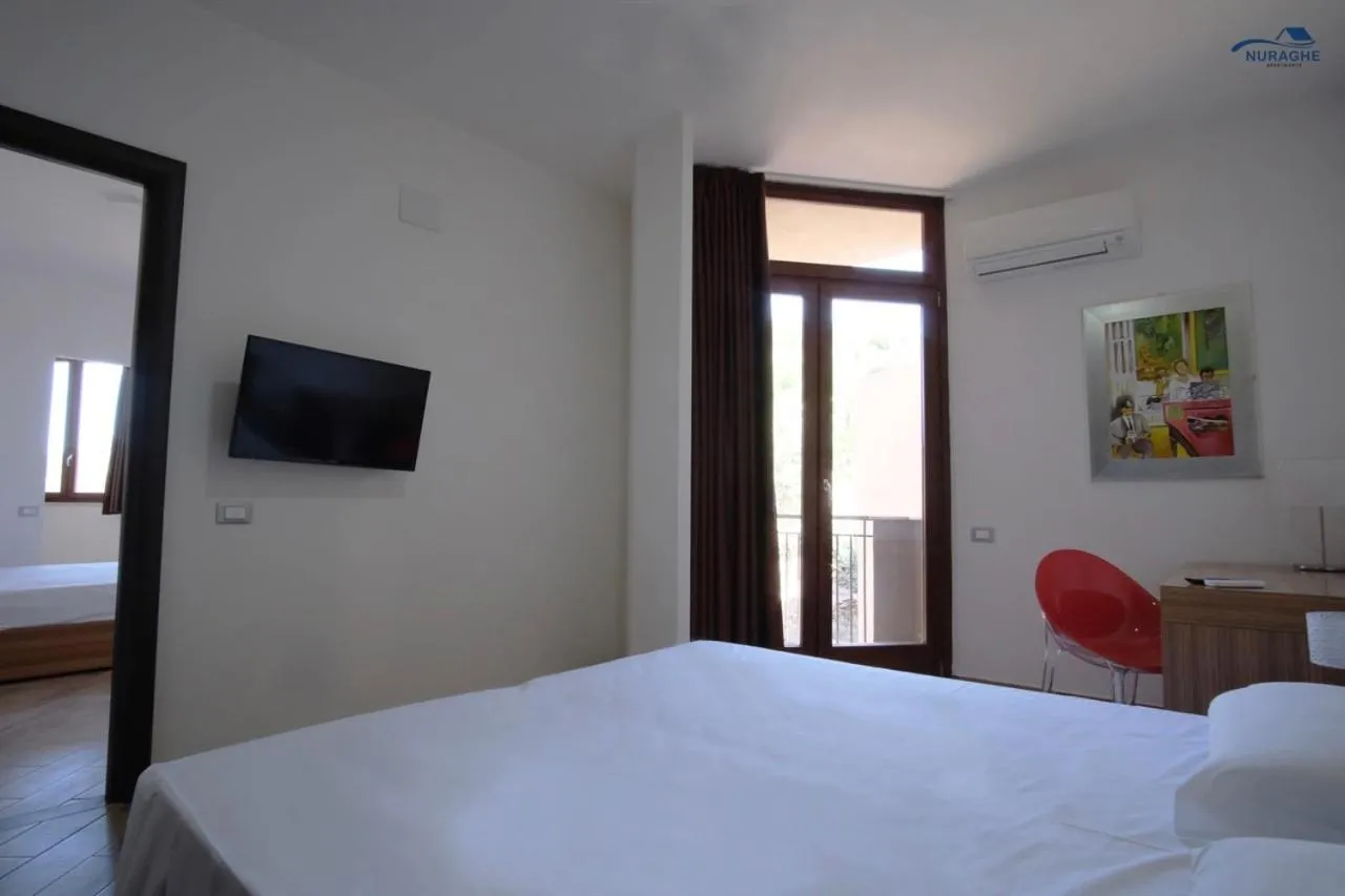 Bed in Nuraghe Apartments