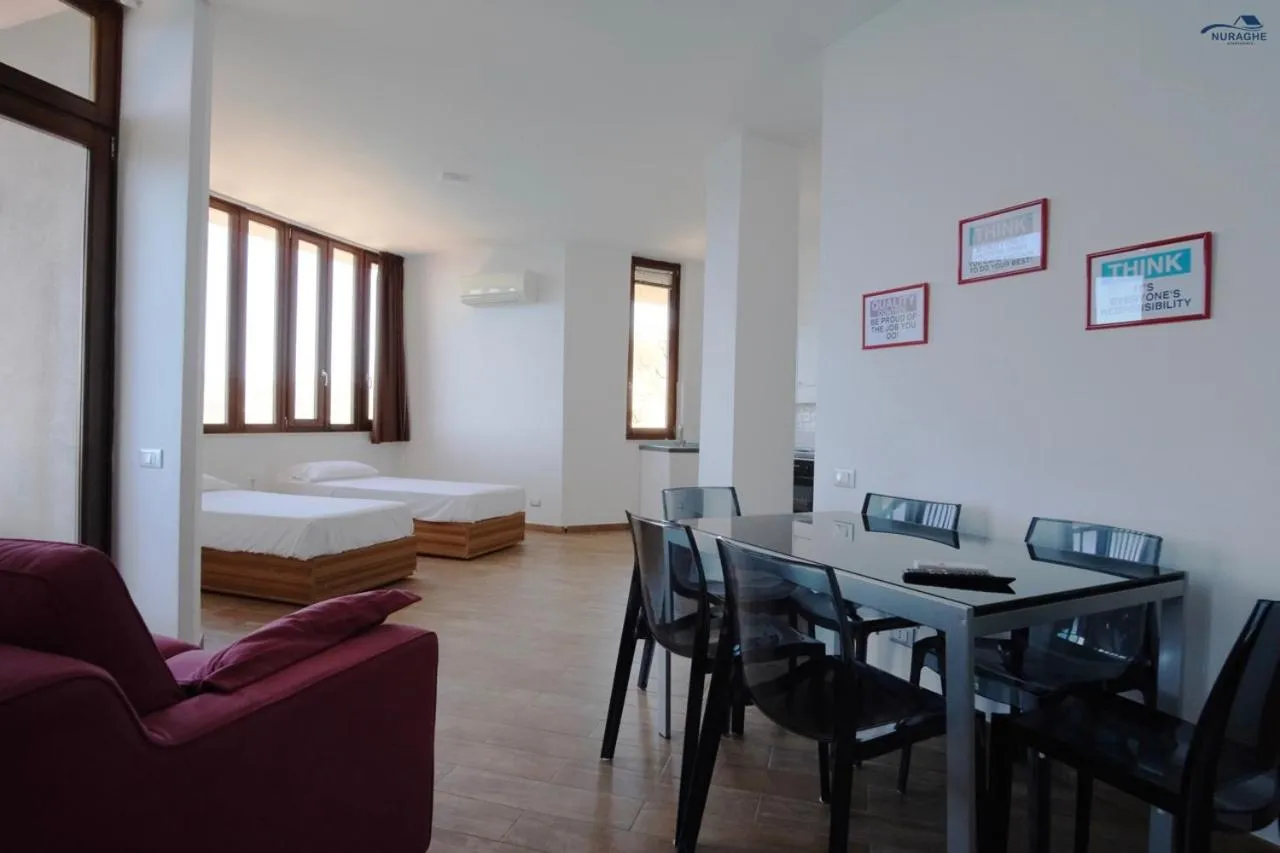 Living room, Bed in Nuraghe Apartments