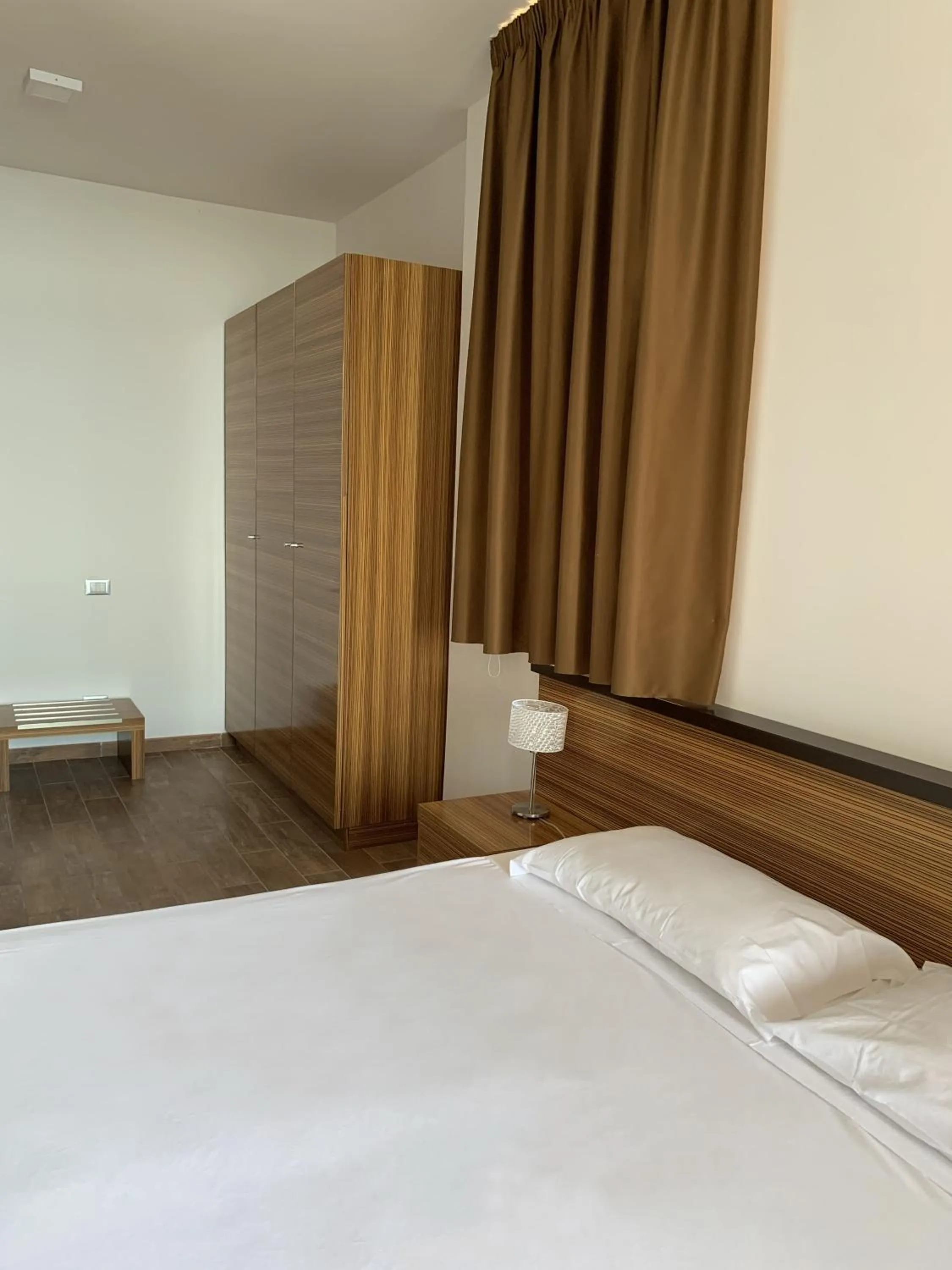 Bed in Nuraghe Apartments