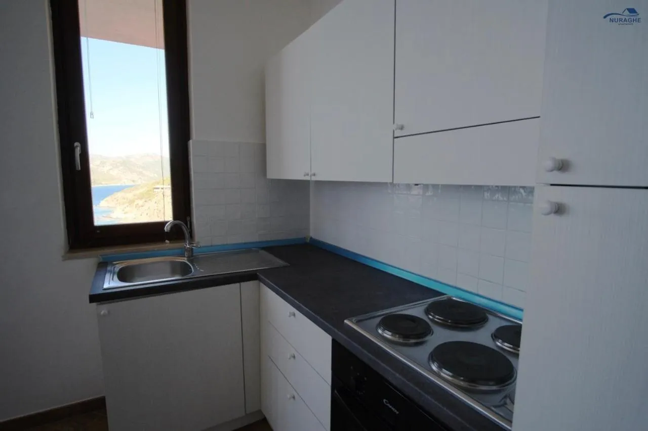kitchen in Nuraghe Apartments
