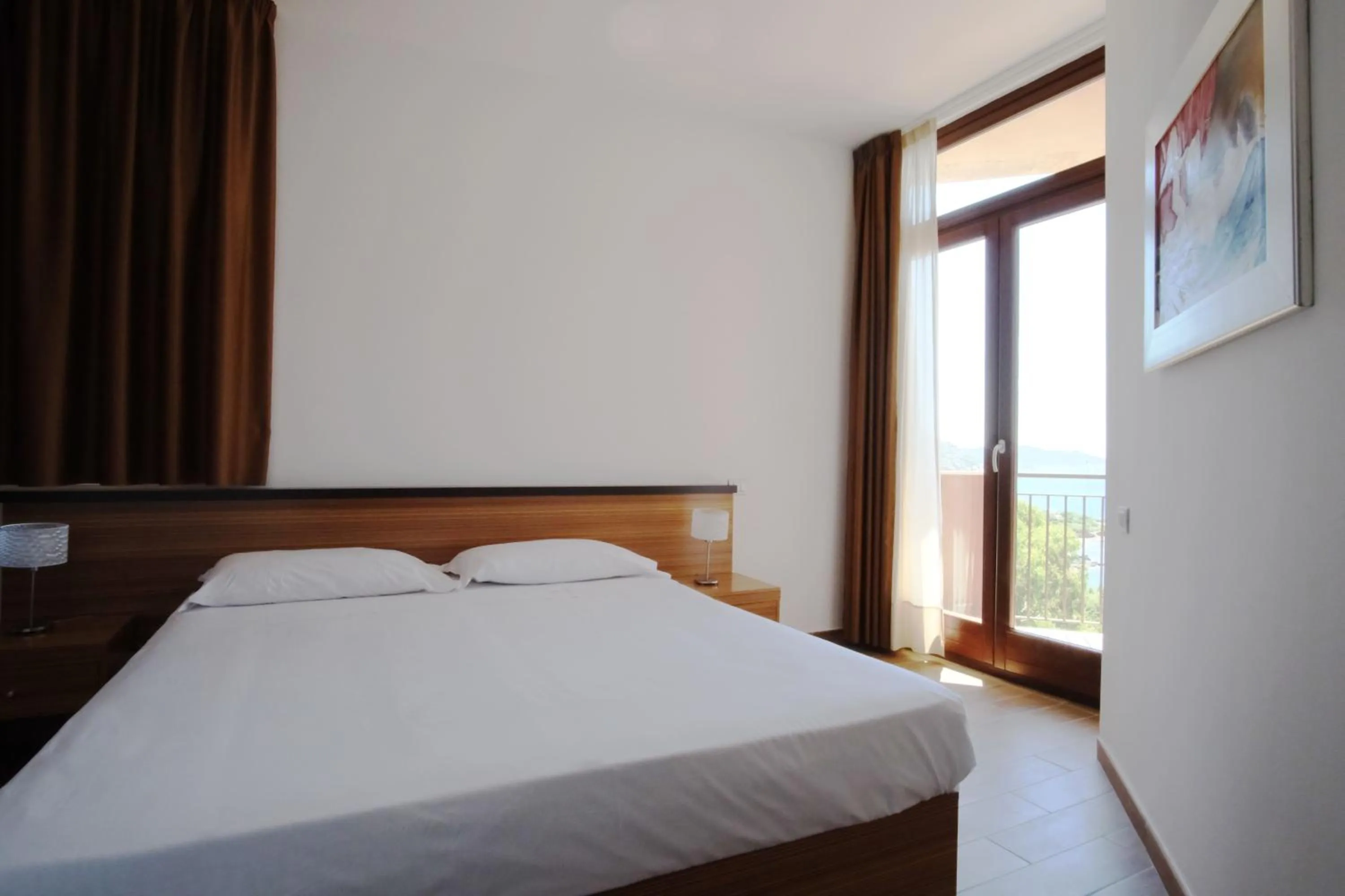 Bed in Nuraghe Apartments