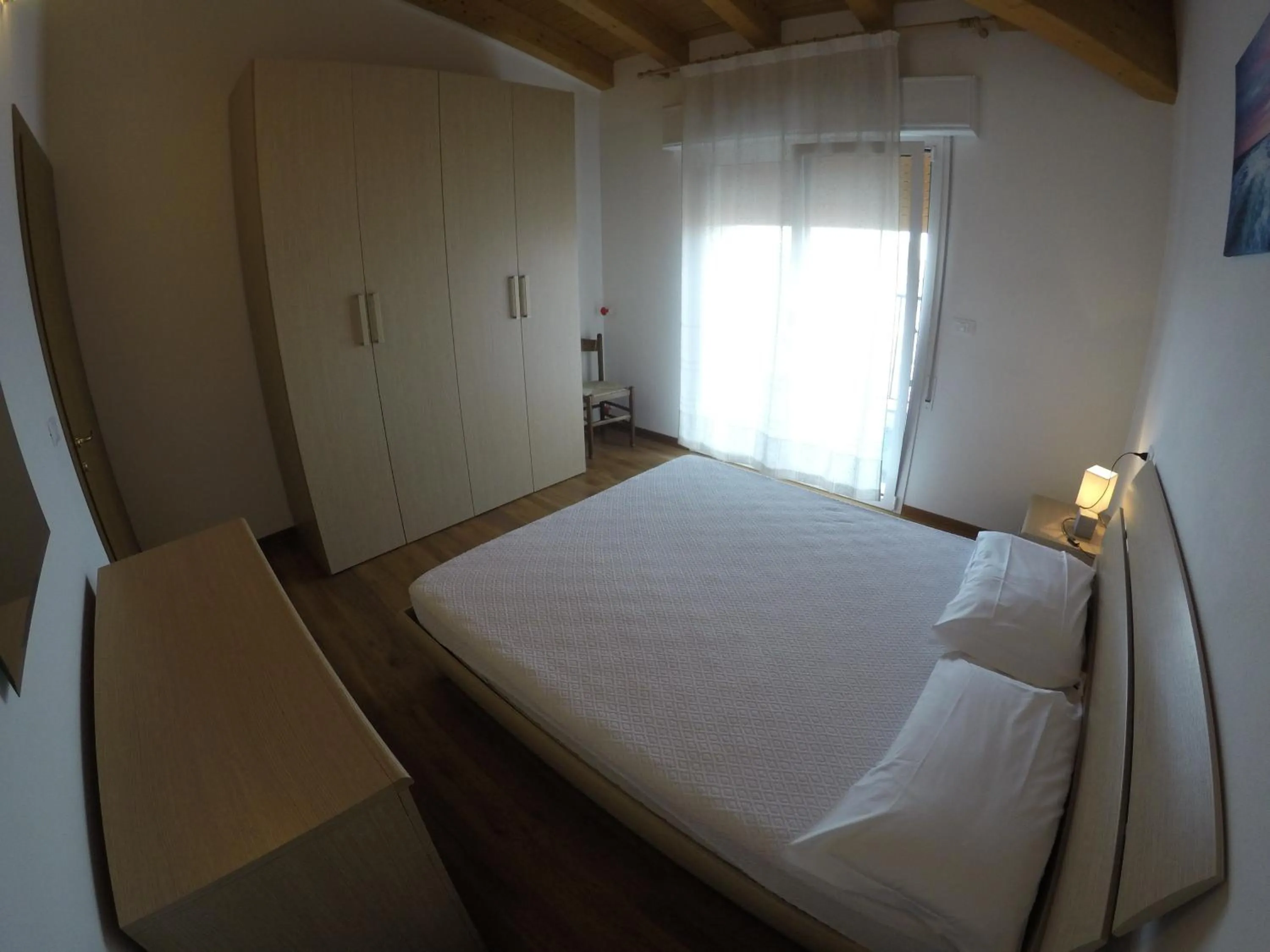 Bedroom in Residence Caorle Apartments - Agenzia Cocal