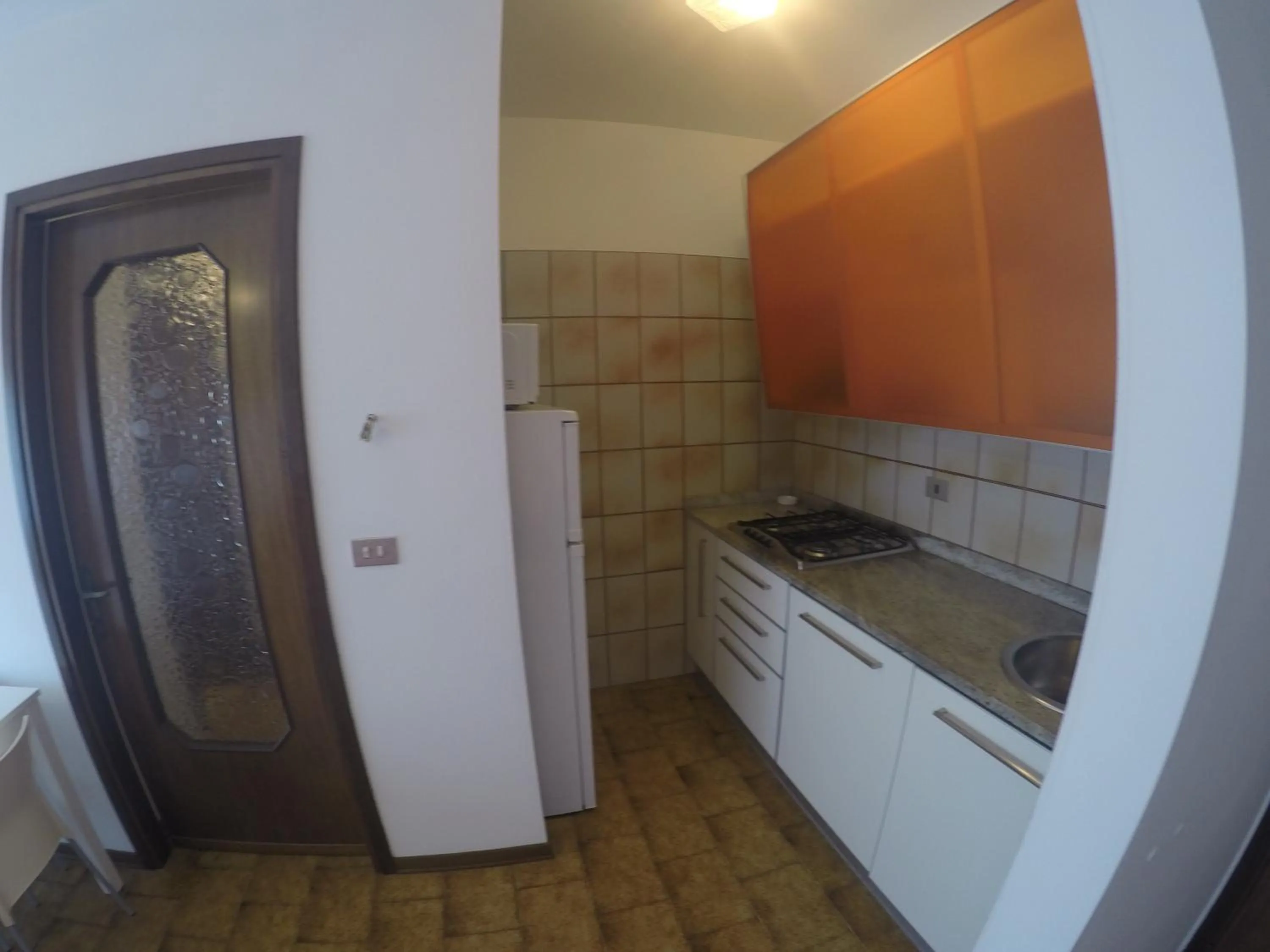 Kitchen or kitchenette in Residence Caorle Apartments - Agenzia Cocal