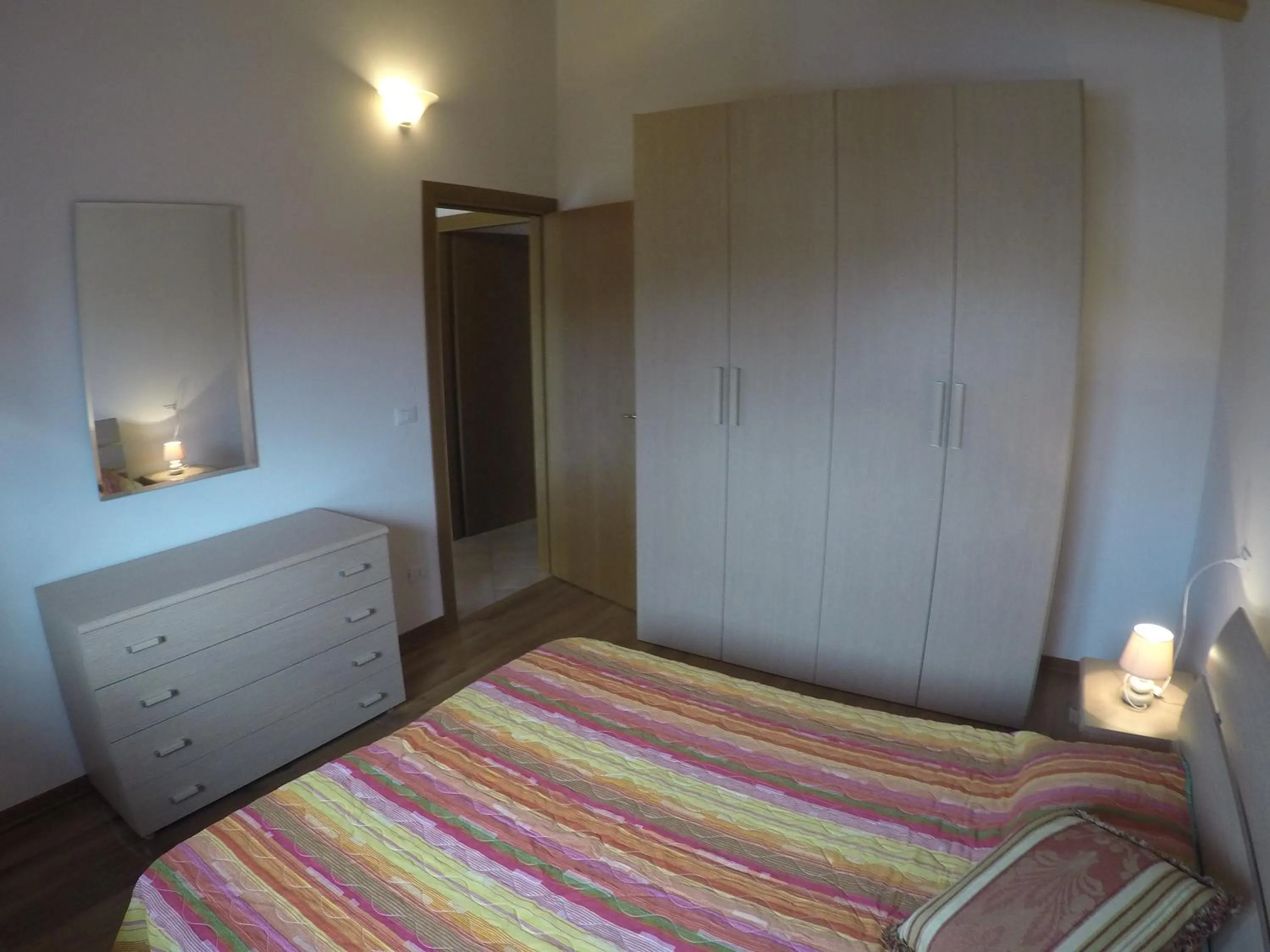 Bedroom in Residence Caorle Apartments - Agenzia Cocal