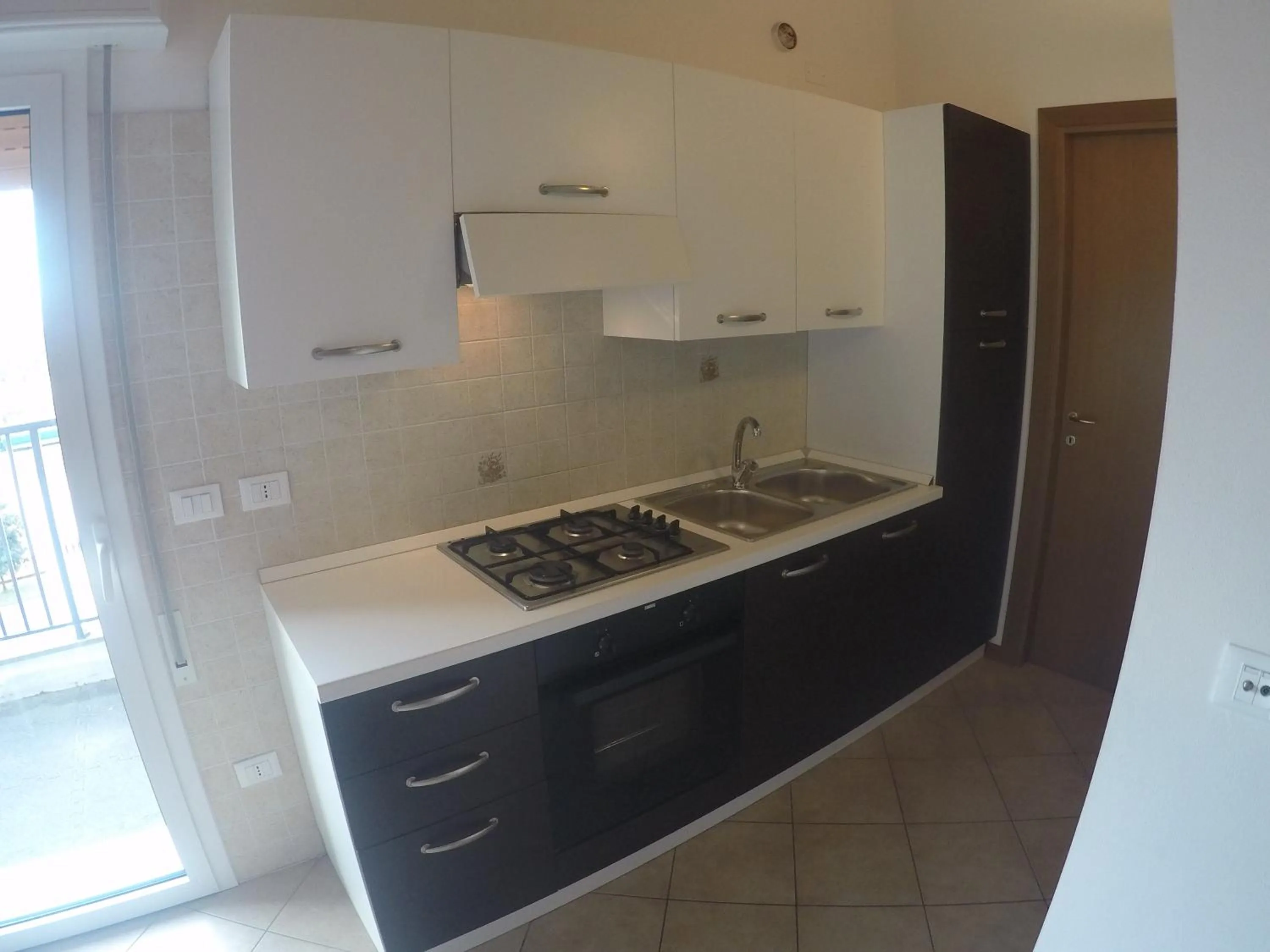 Kitchen or kitchenette in Residence Caorle Apartments - Agenzia Cocal