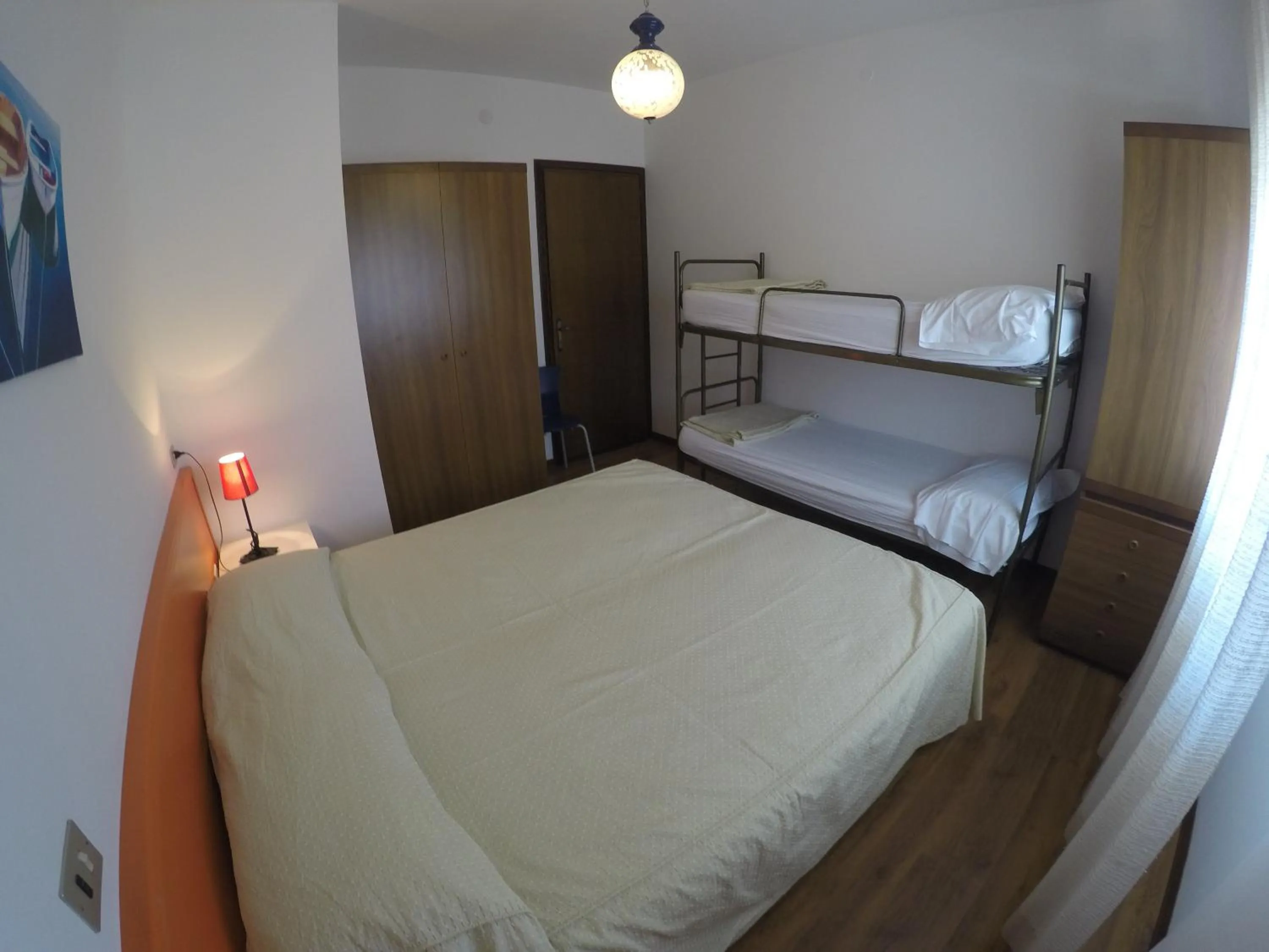 Bedroom in Residence Caorle Apartments - Agenzia Cocal