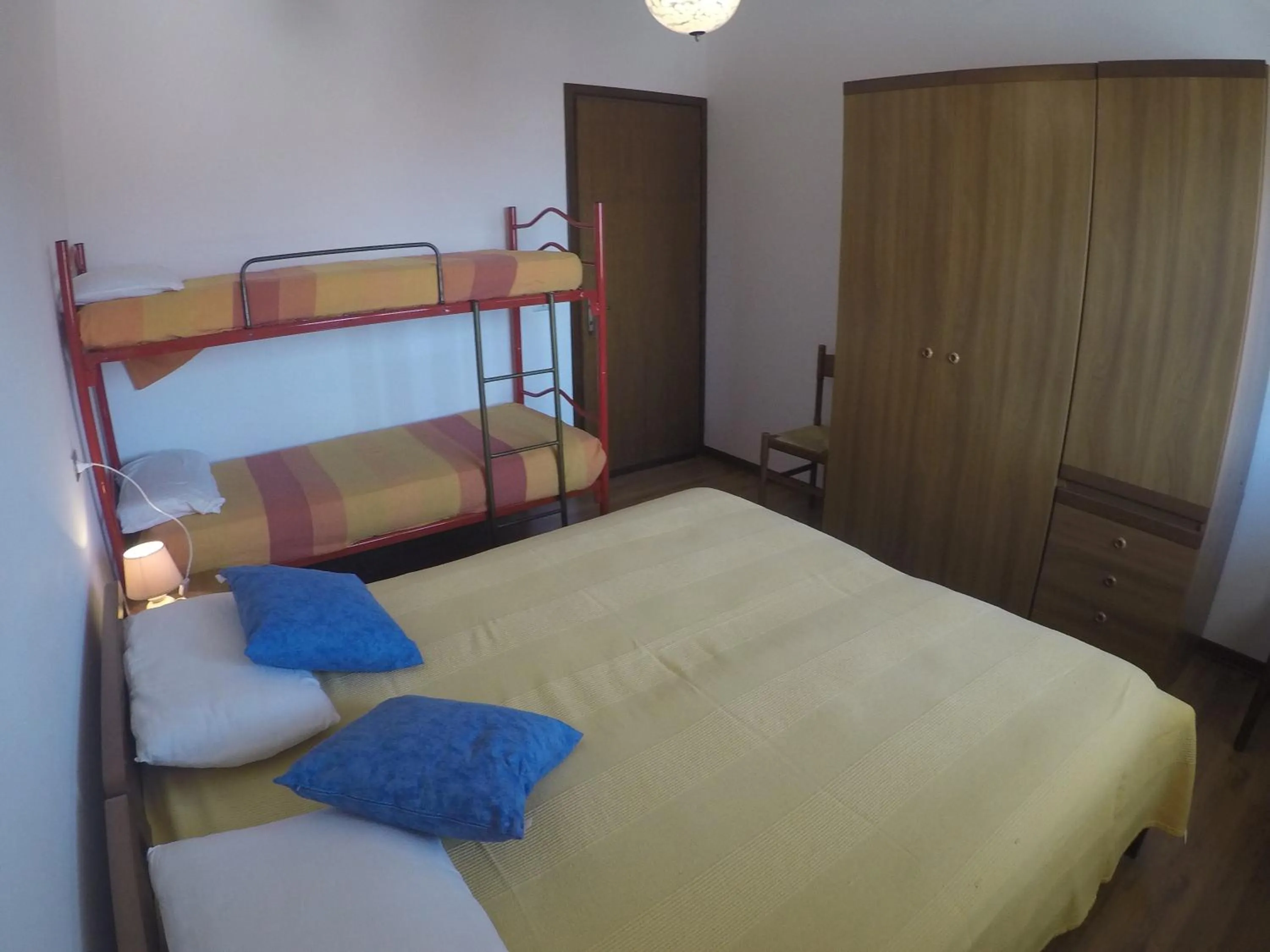 Bedroom in Residence Caorle Apartments - Agenzia Cocal