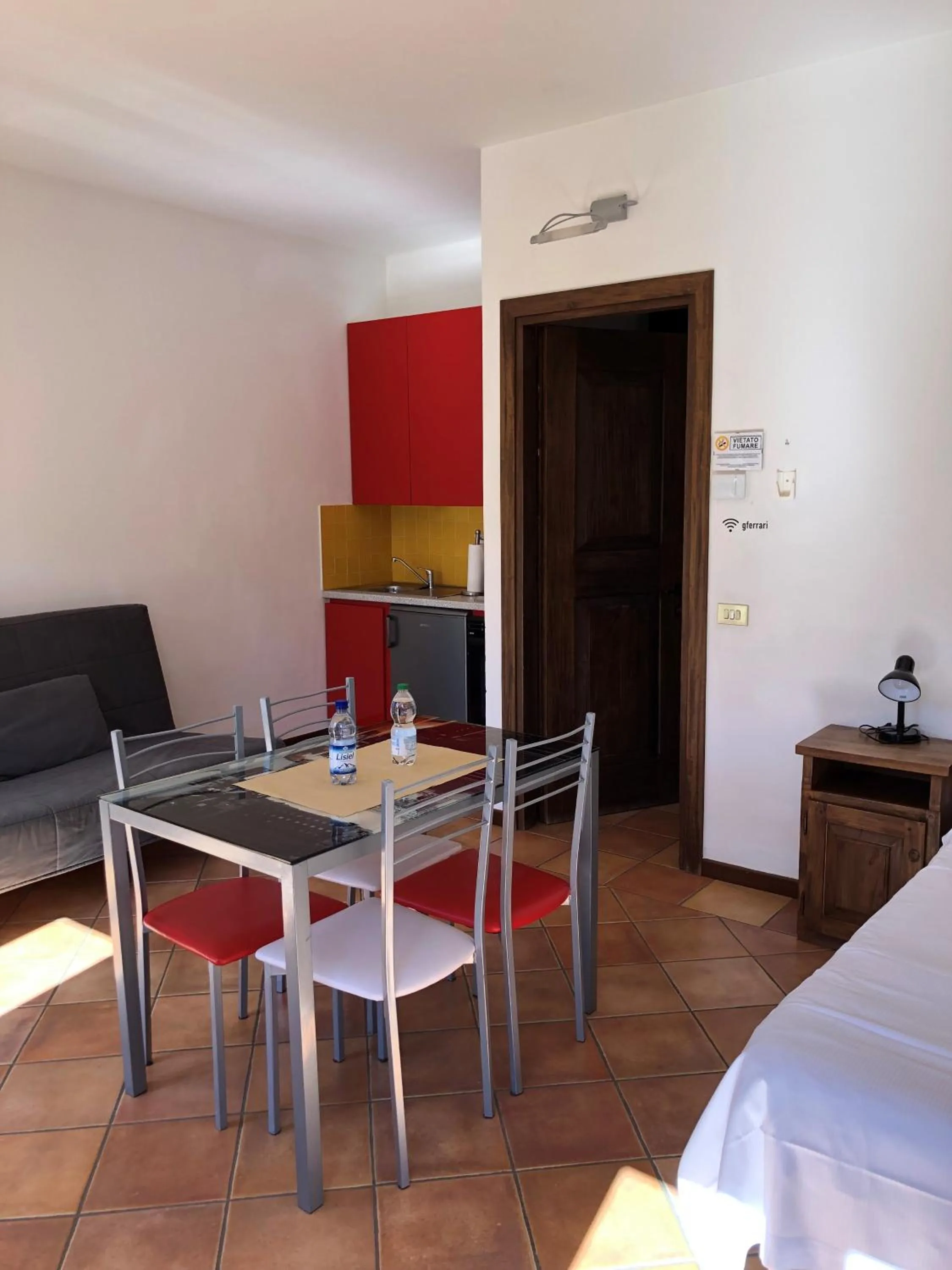 Kitchen or kitchenette, Bed in Appartamenti Ferrari Residence