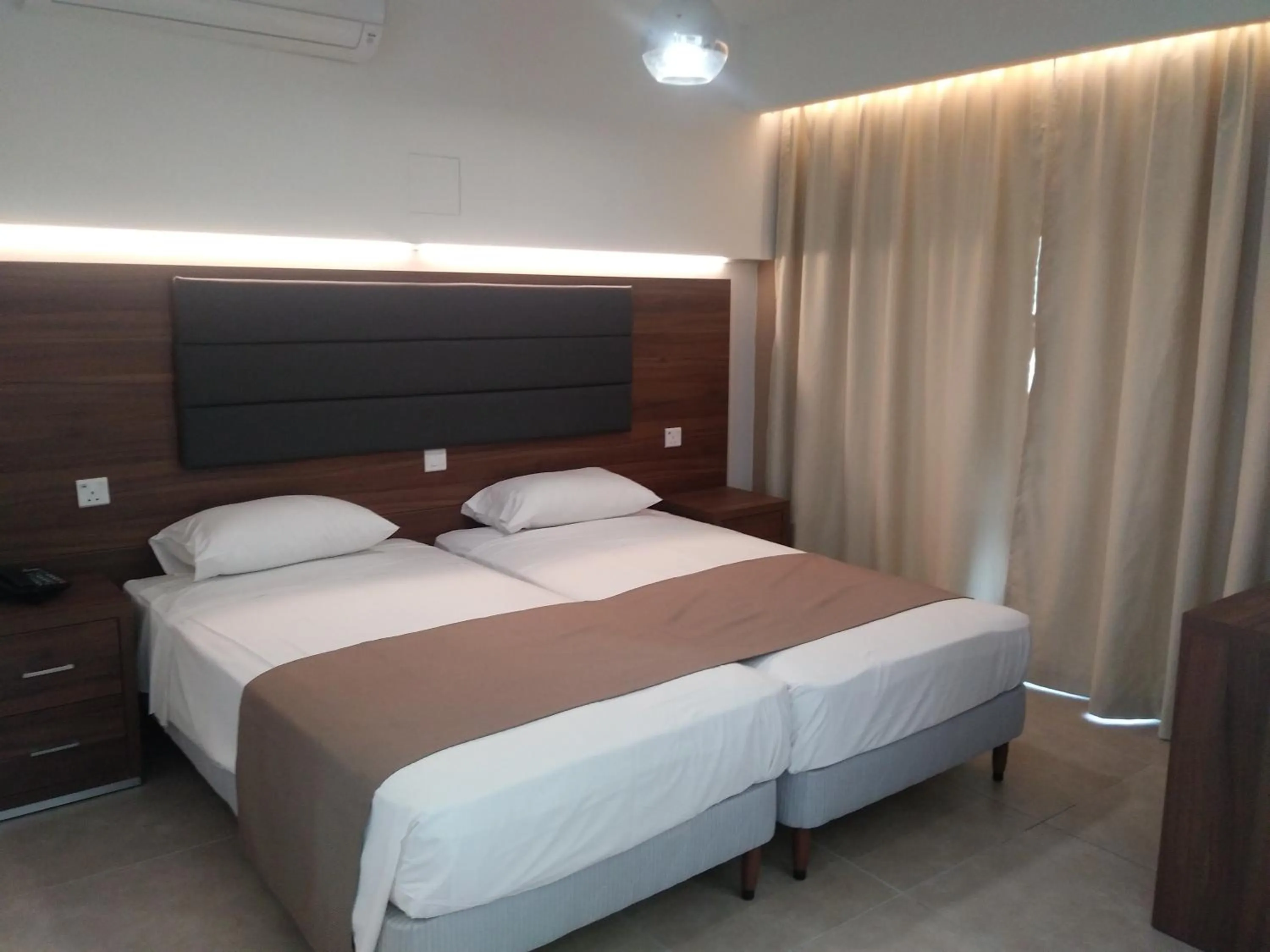 Bed in Livas Hotel Apartments