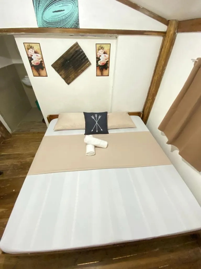 Bed in MiL's Hillside Tourist Inn