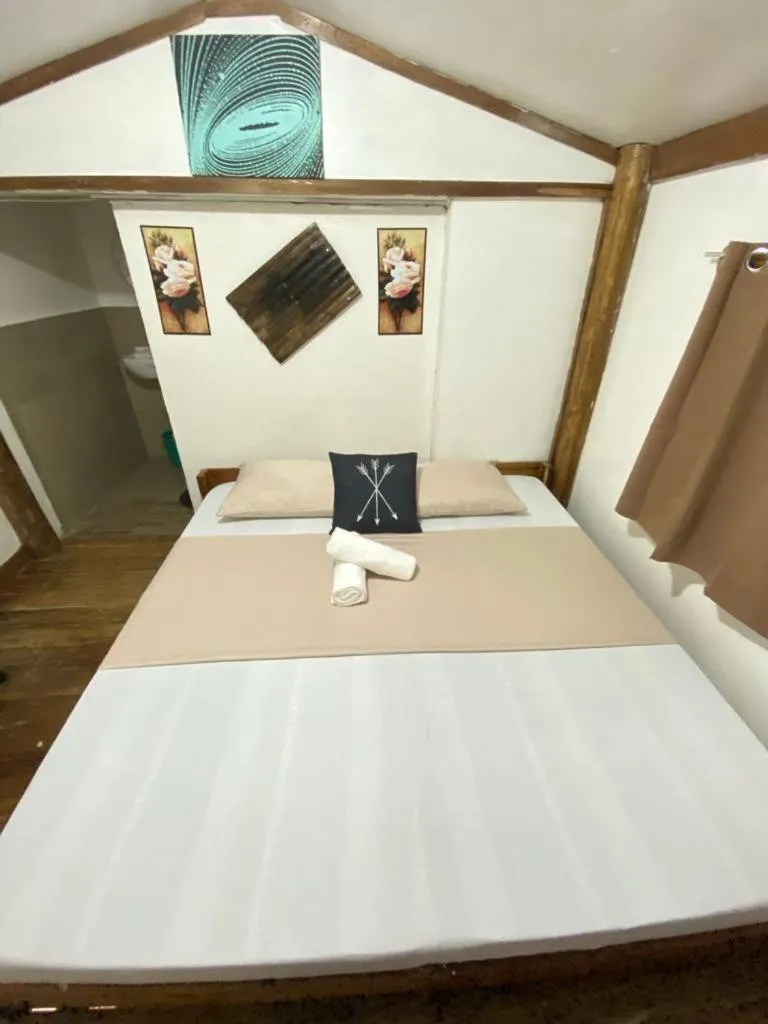 Bed in MiL's Hillside Tourist Inn