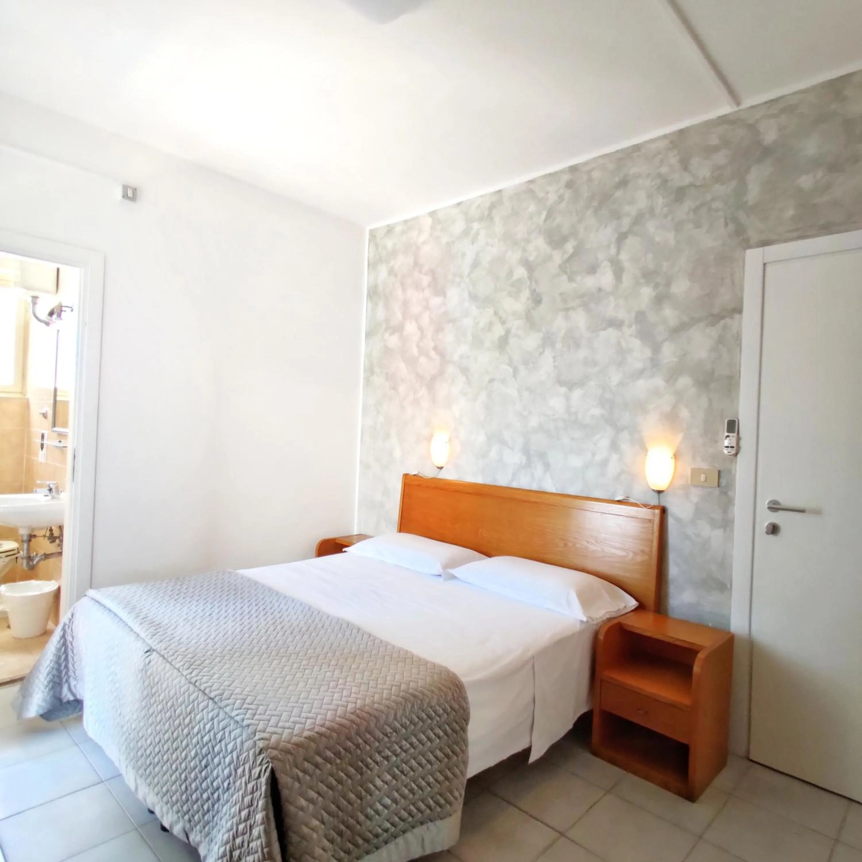 Bed in Piccolo Hotel