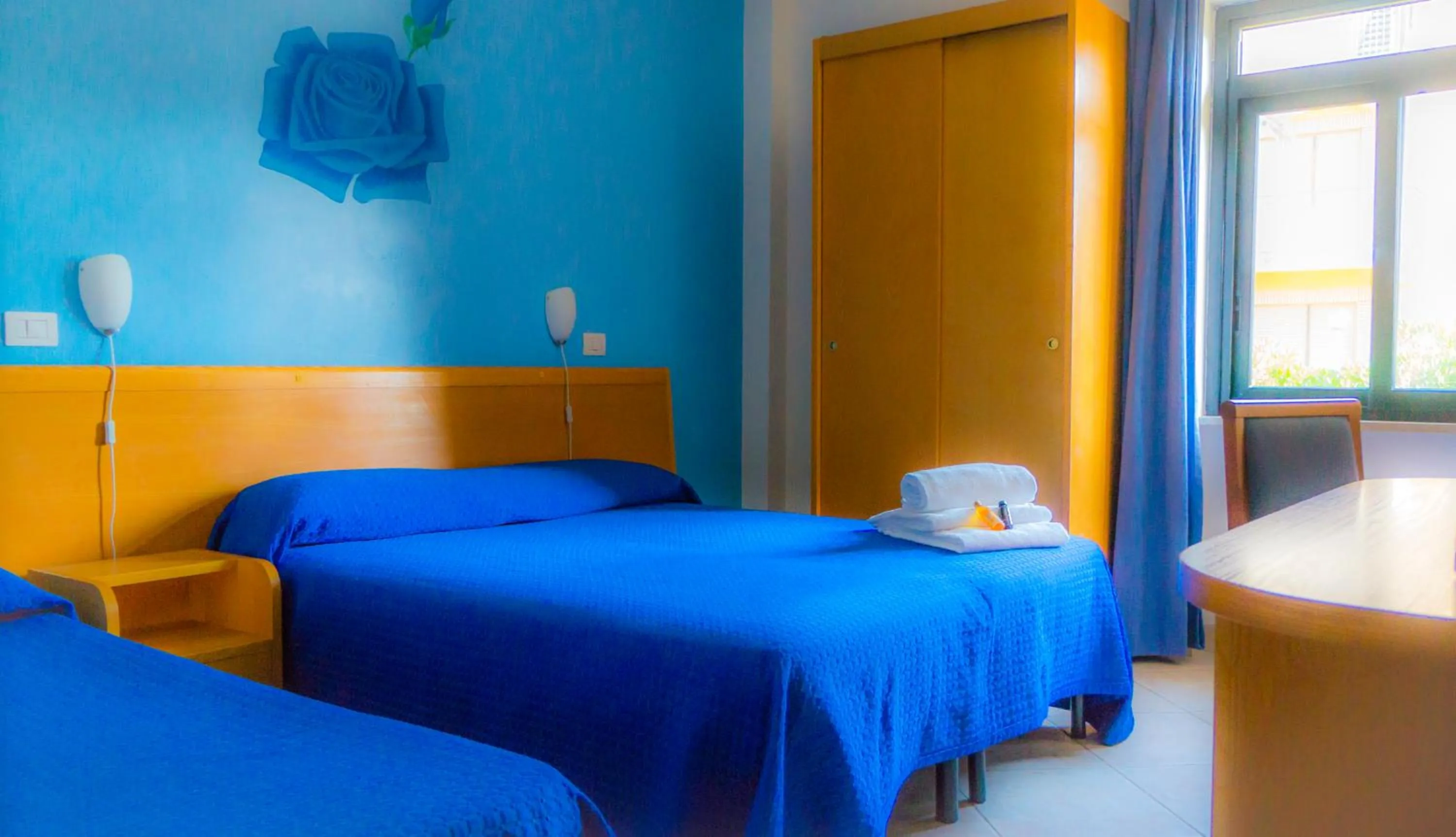 Bed in Piccolo Hotel