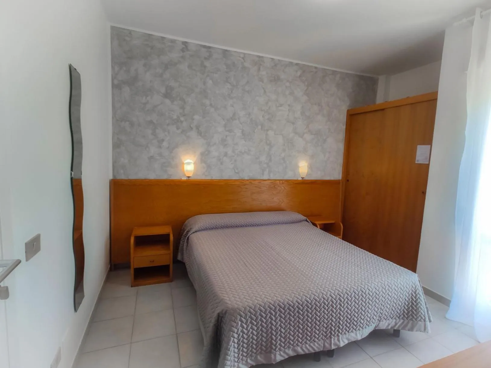 Bed in Piccolo Hotel