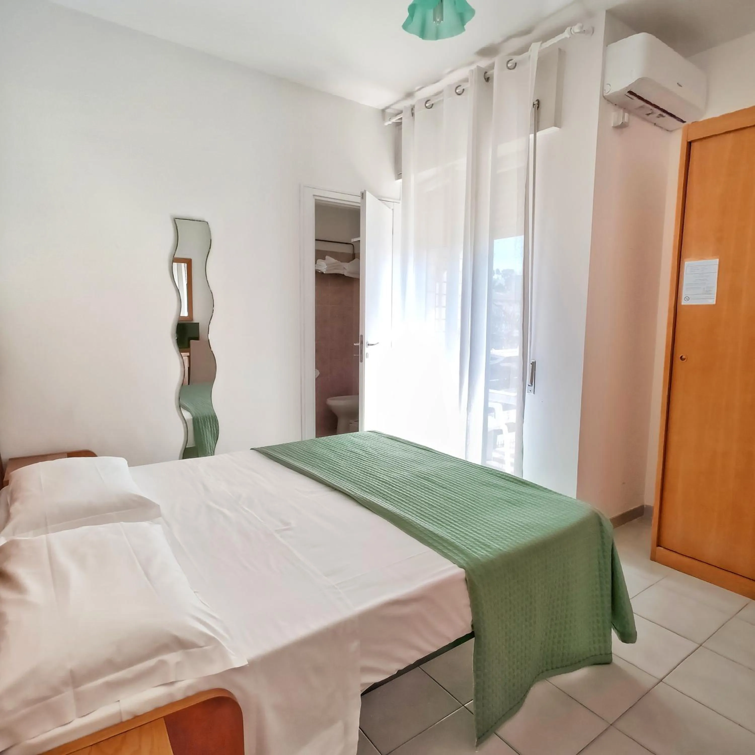 Bed in Piccolo Hotel