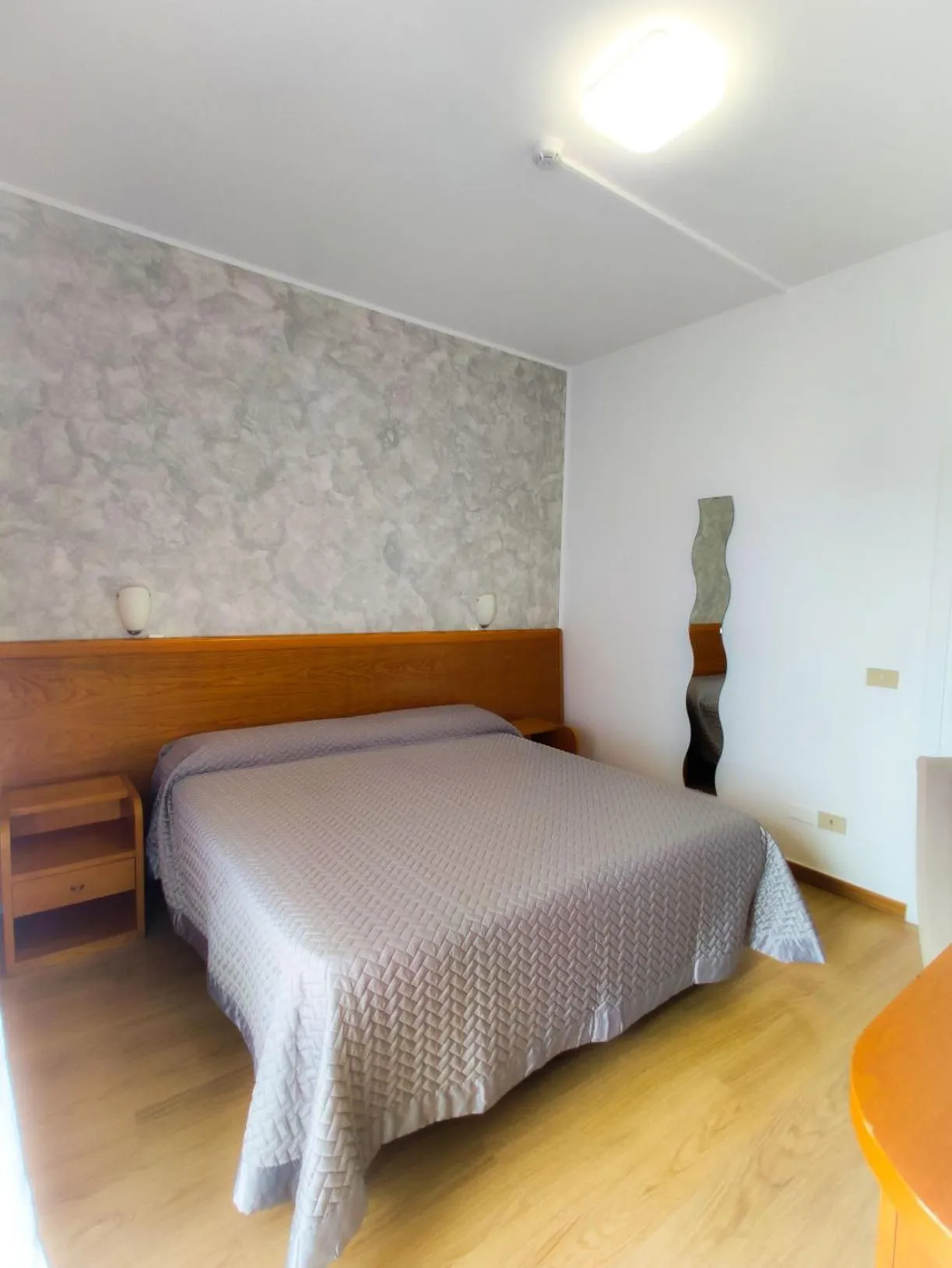 Bed in Piccolo Hotel