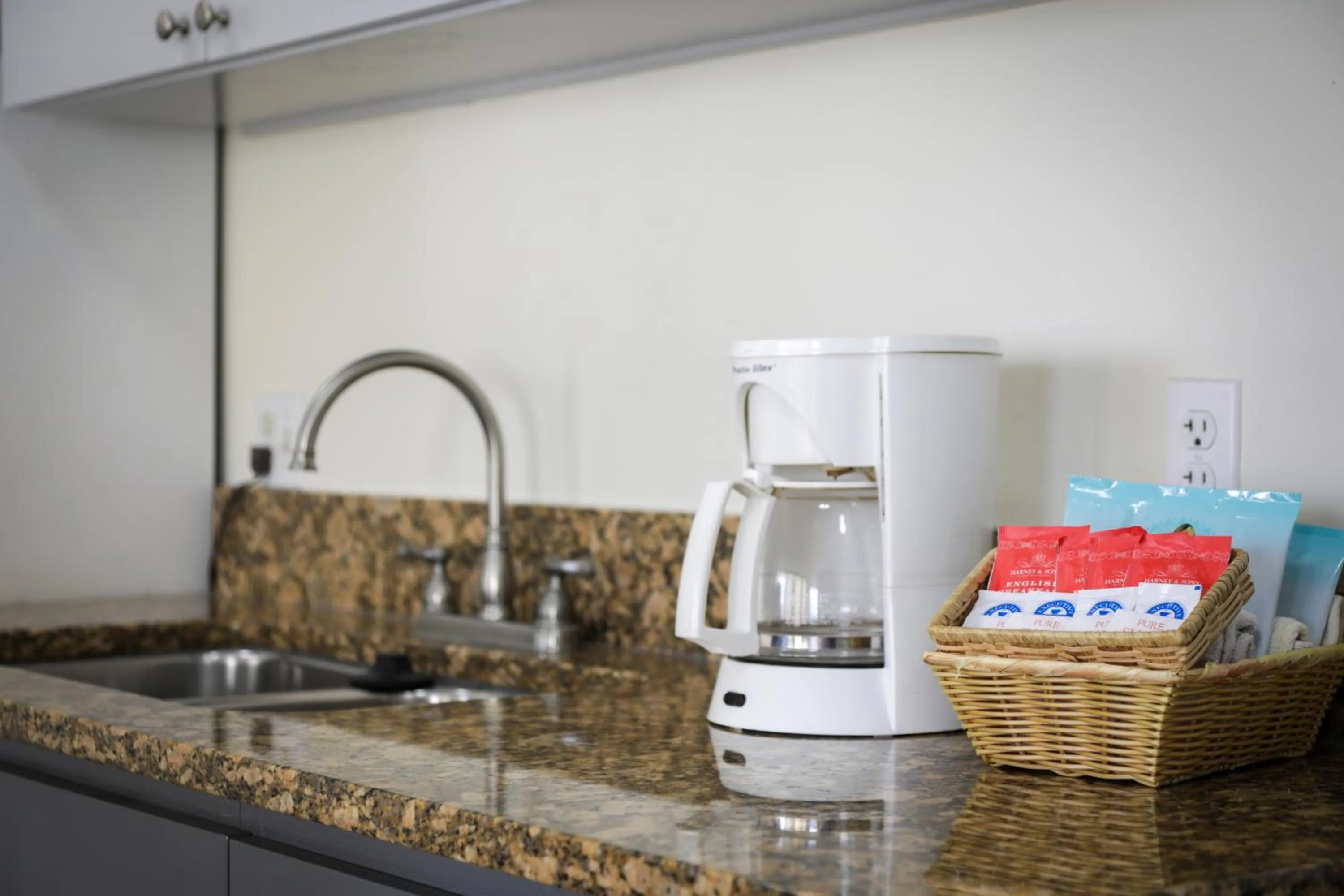 Kitchen or kitchenette in Aston at the Waikiki Banyan