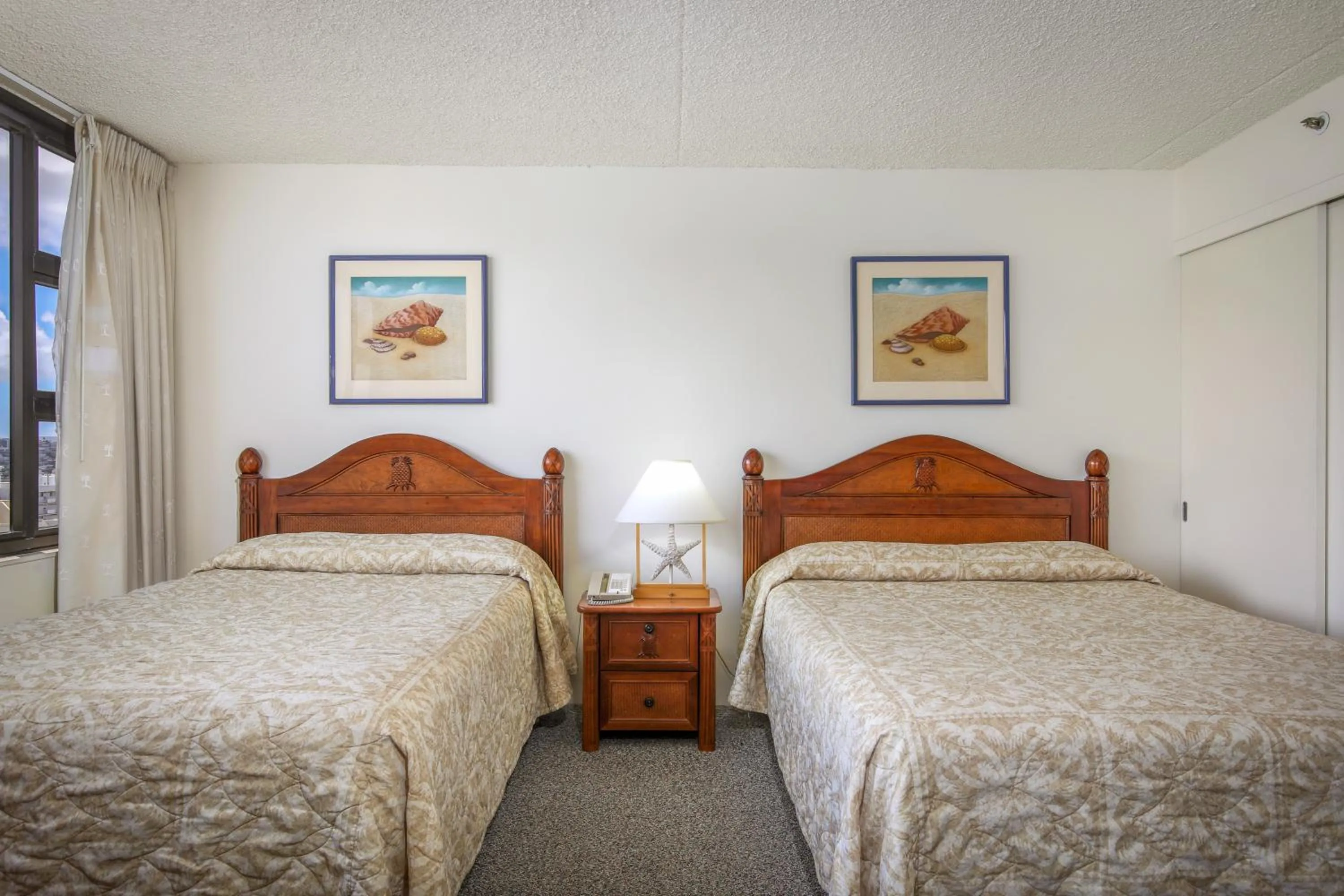 Bed in Aston at the Waikiki Banyan