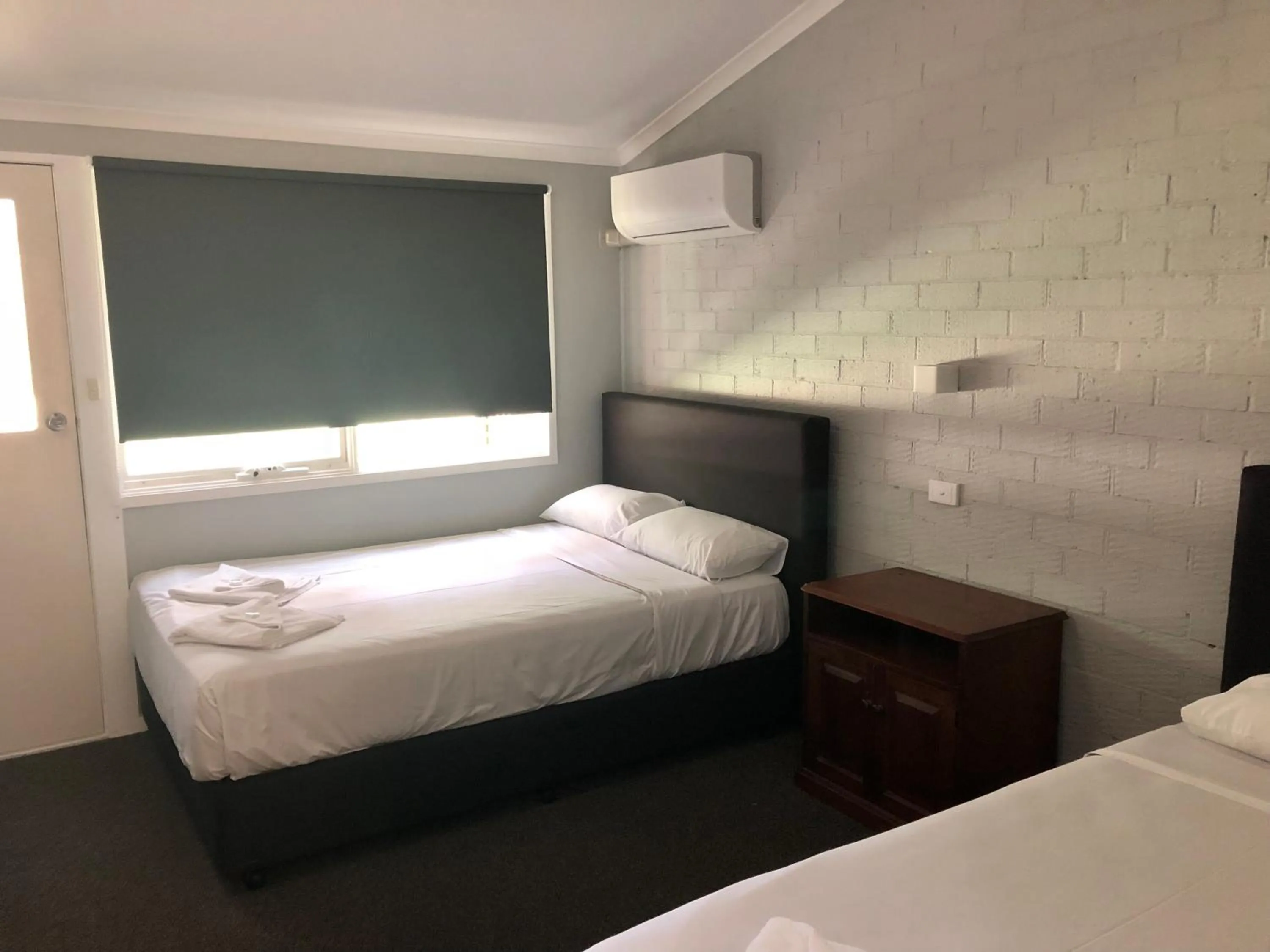 Bed in Bateau Bay Hotel