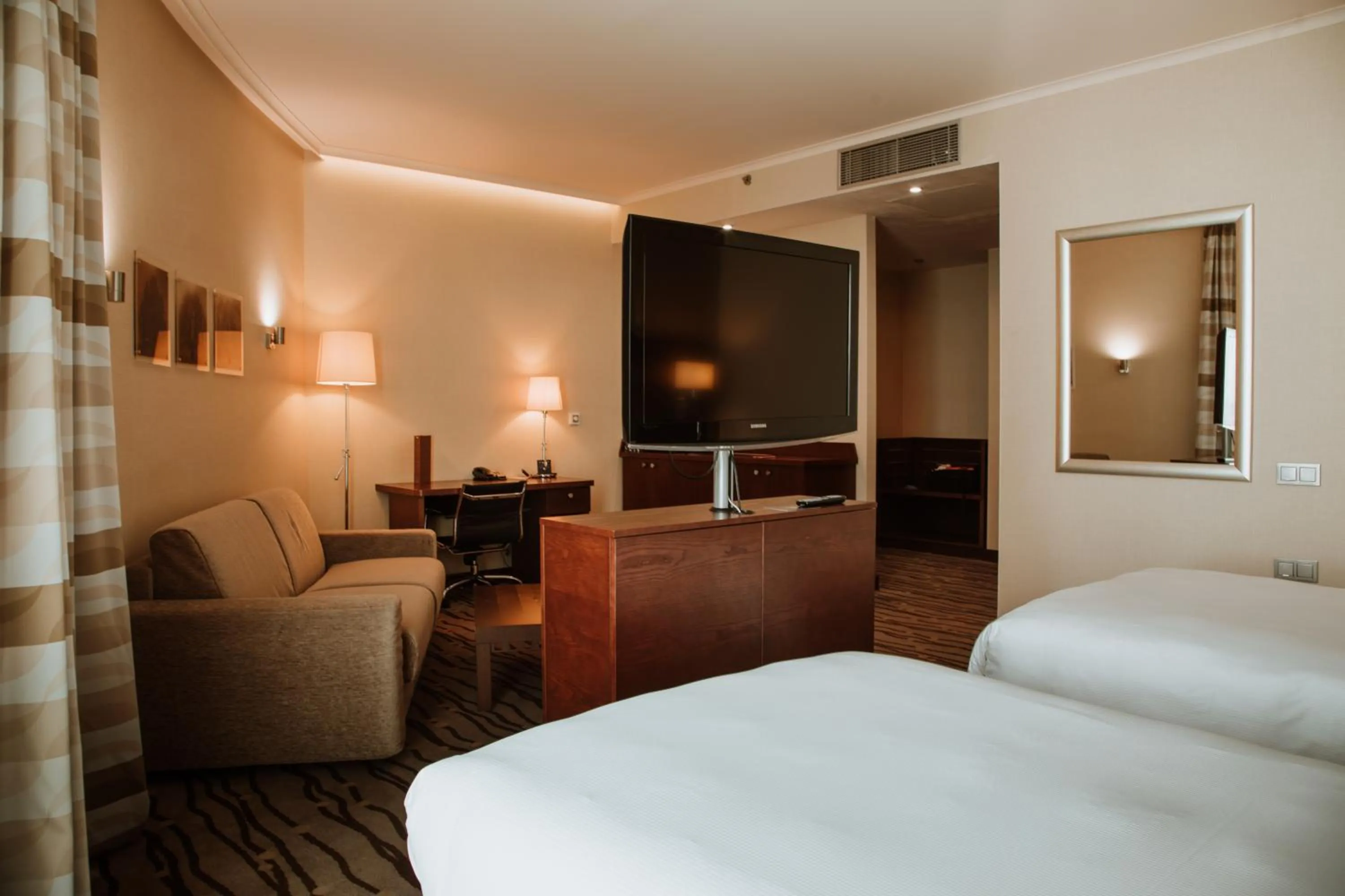 Living room, Bed in DoubleTree by Hilton Bratislava