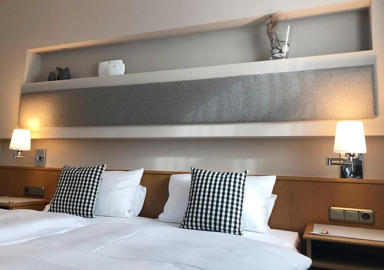 Bed in Mangolds Boutique Hotel & Fruehstuecksmeisterei