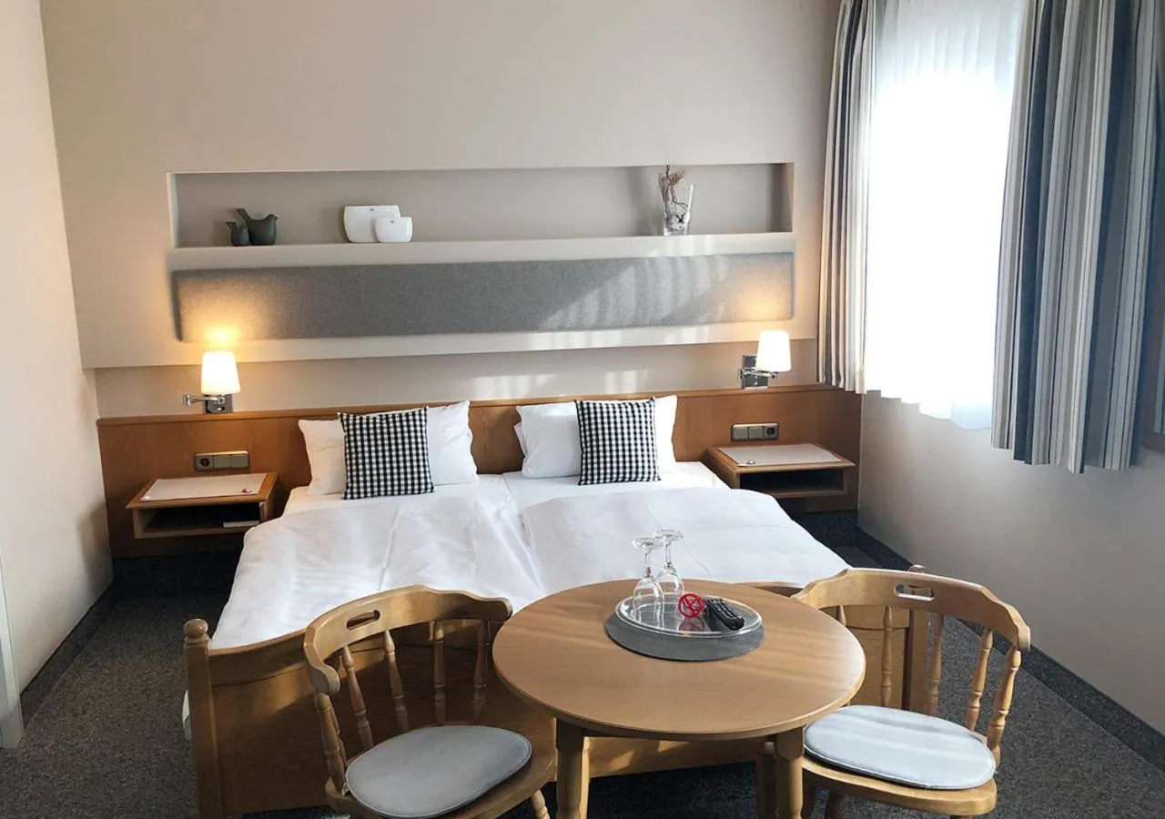 Bed in Mangolds Boutique Hotel & Fruehstuecksmeisterei