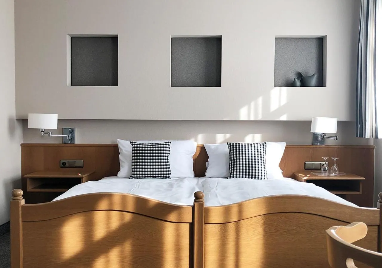 Bed in Mangolds Boutique Hotel & Fruehstuecksmeisterei