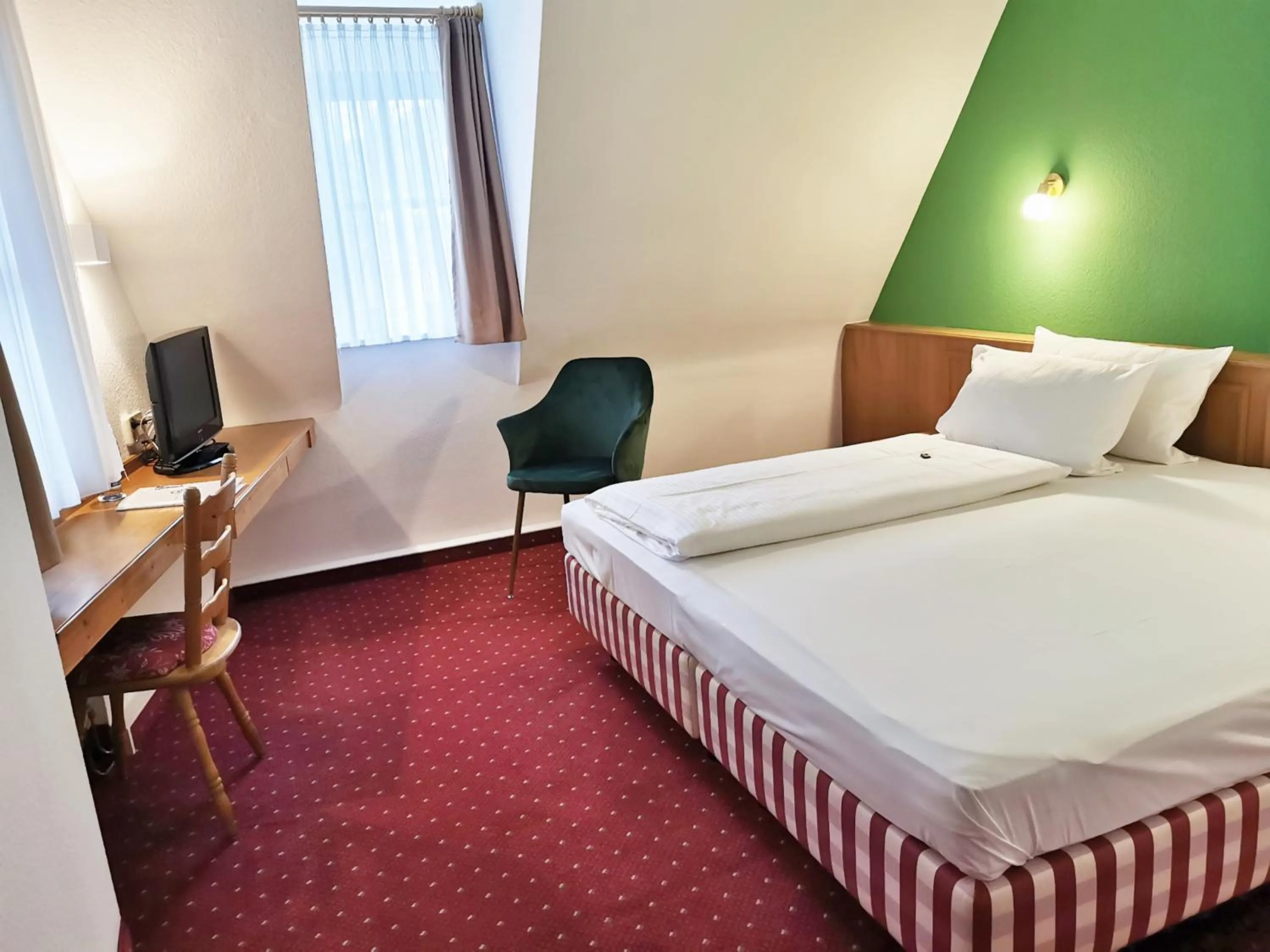 Photo of the whole room, Bed in Landhotel Ölmühle