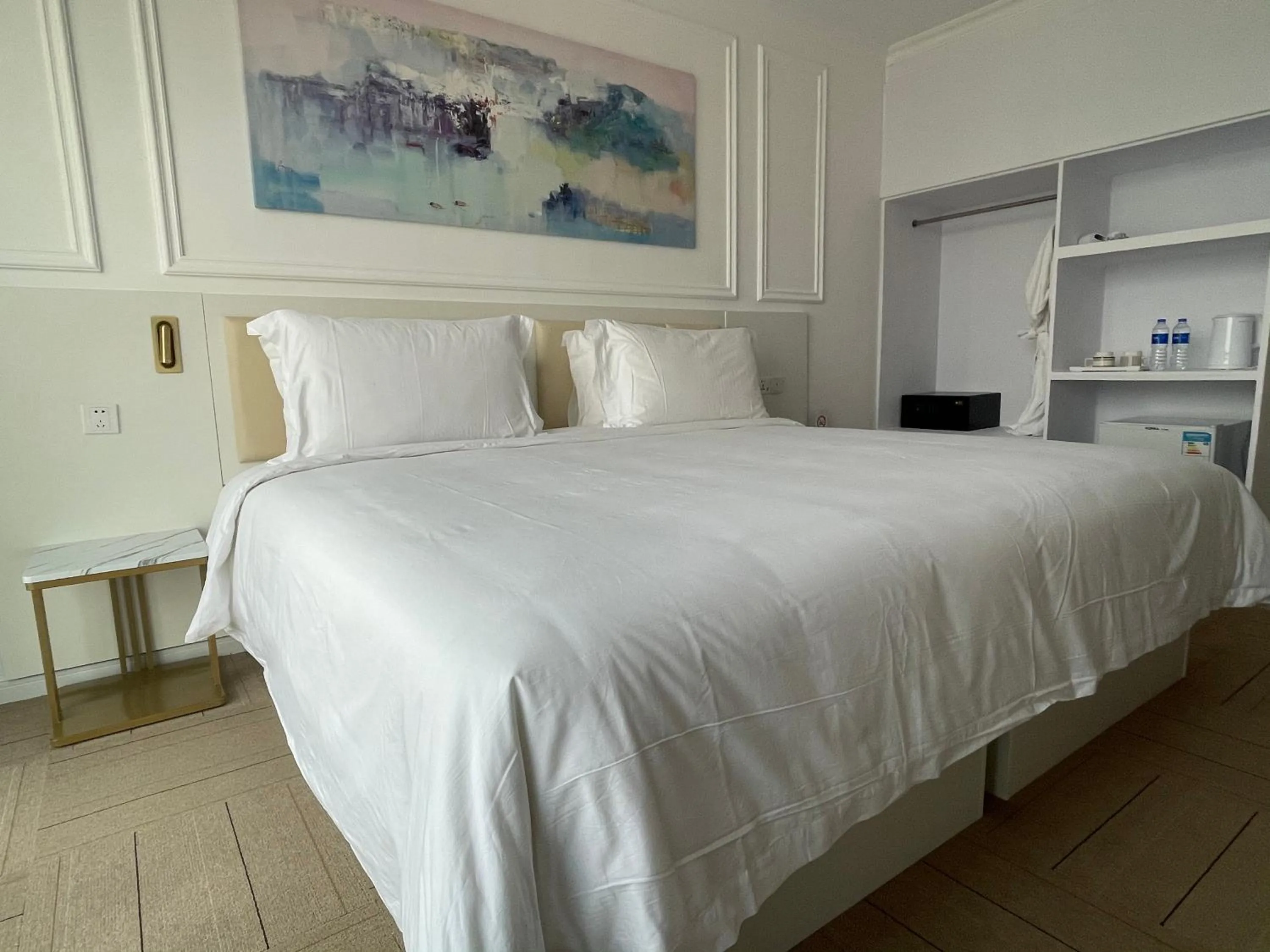 Bed in Magnificent International Hotel