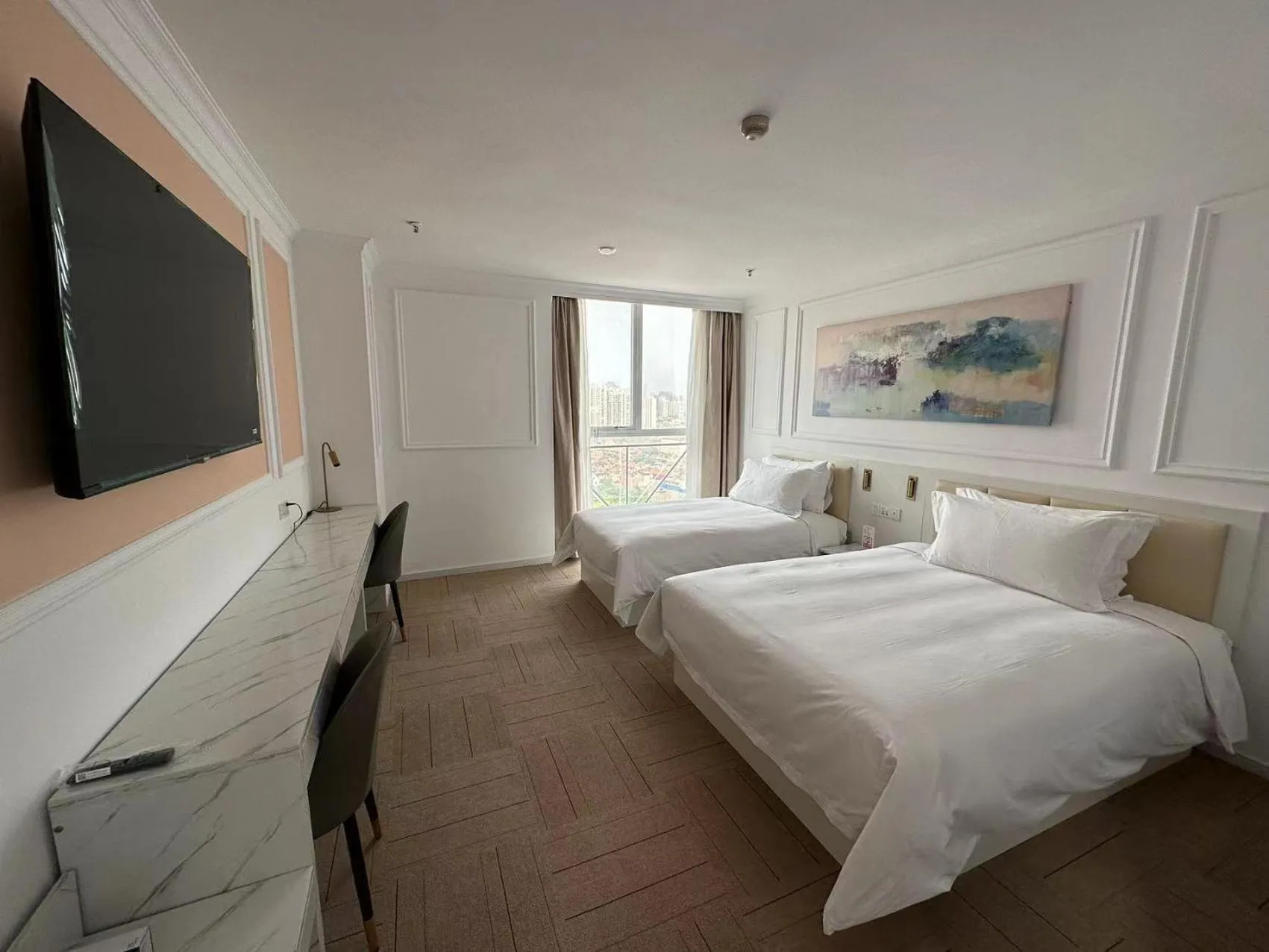 Bed in Magnificent International Hotel