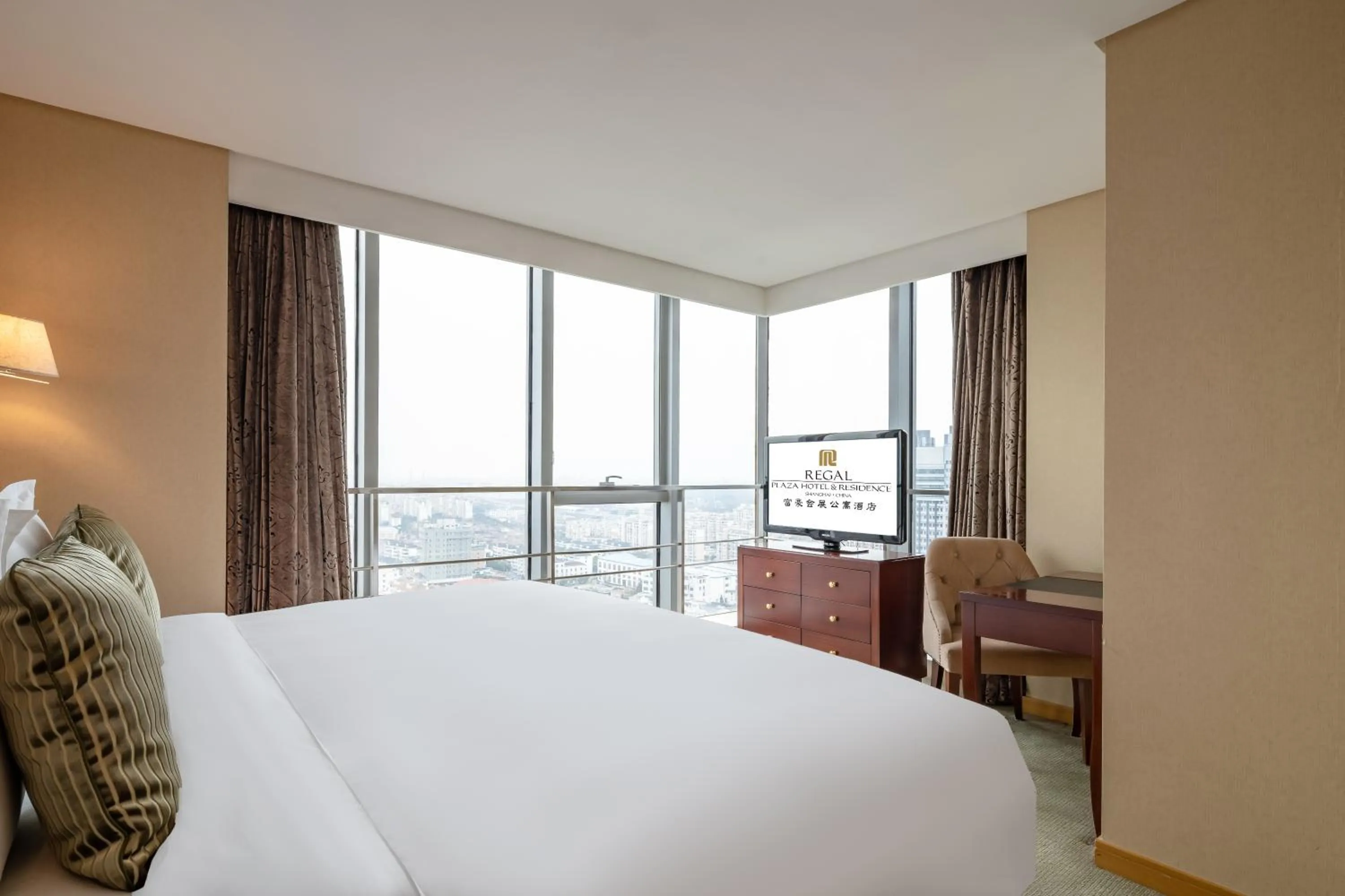 Bed in Regal Plaza Hotel & Residence