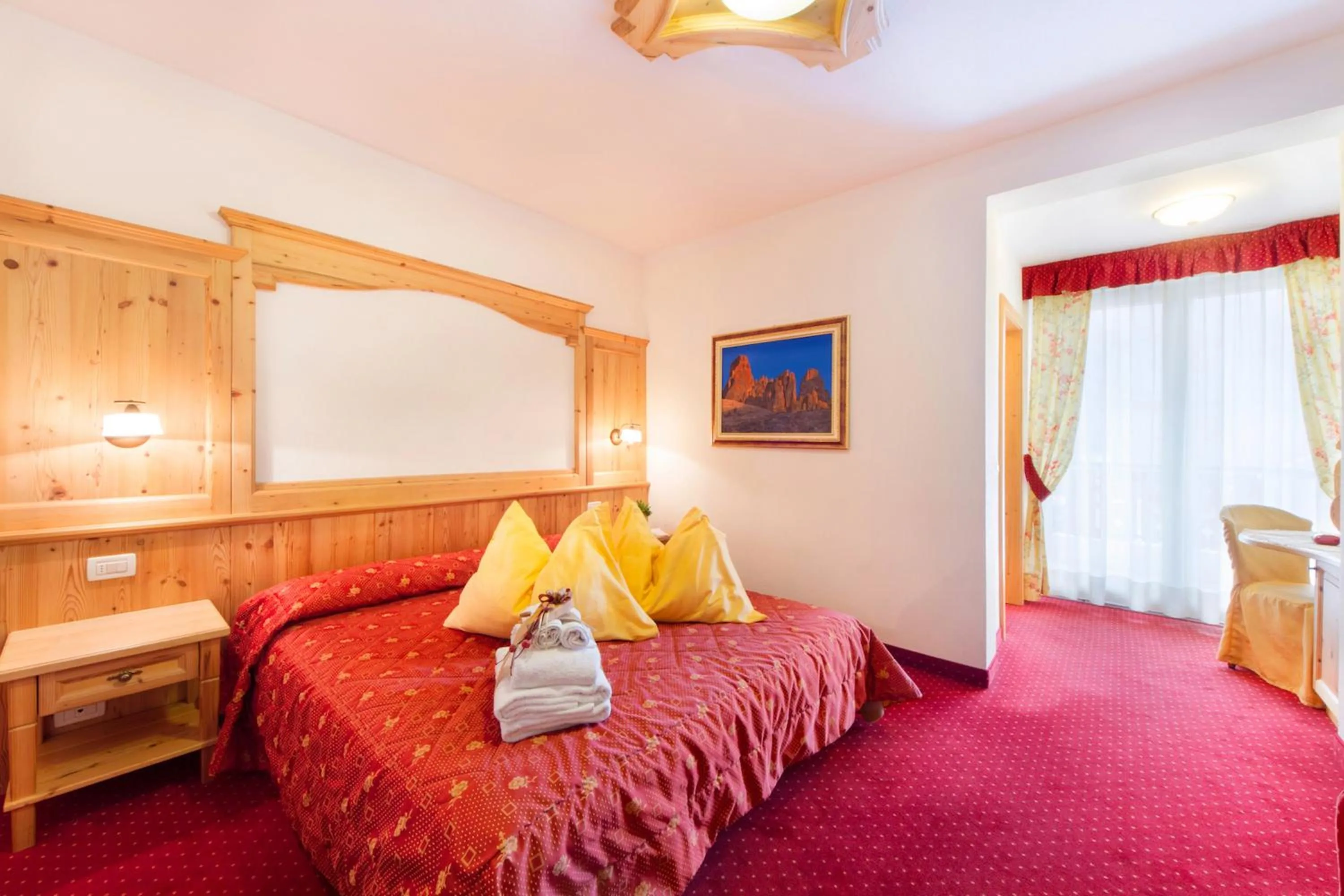 Bed in Alpotel Dolomiten