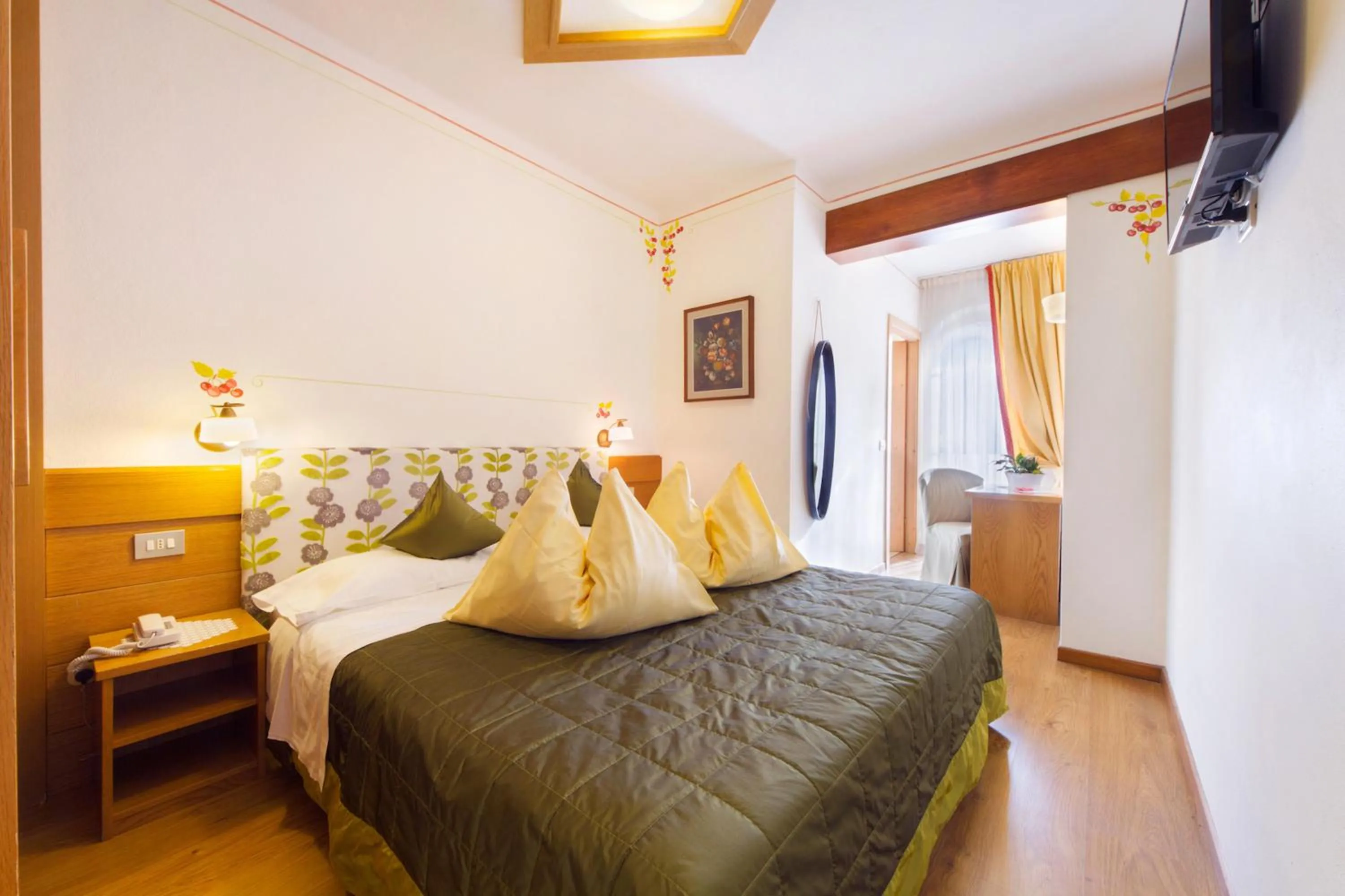 Bed in Alpotel Dolomiten