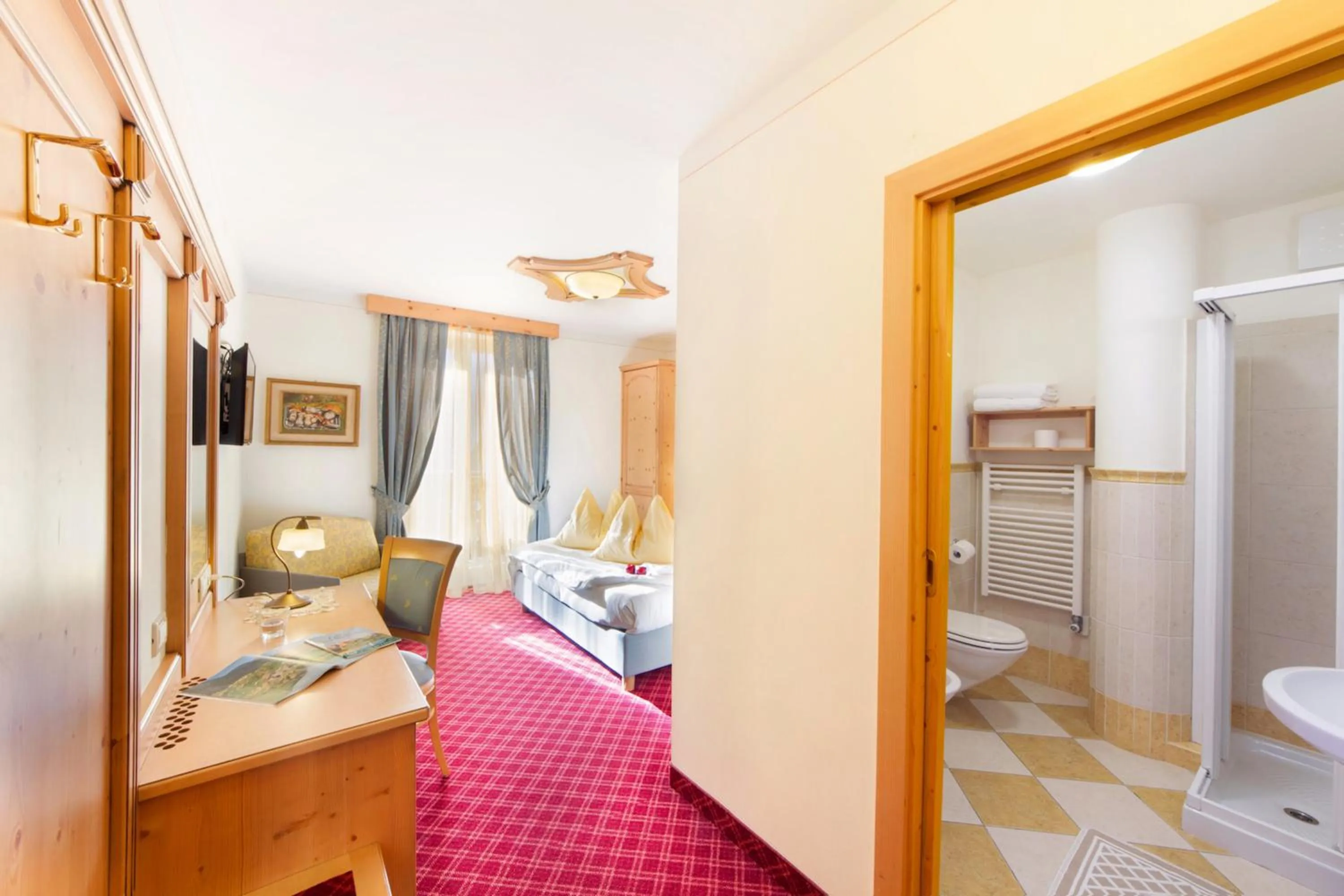 Bed in Alpotel Dolomiten