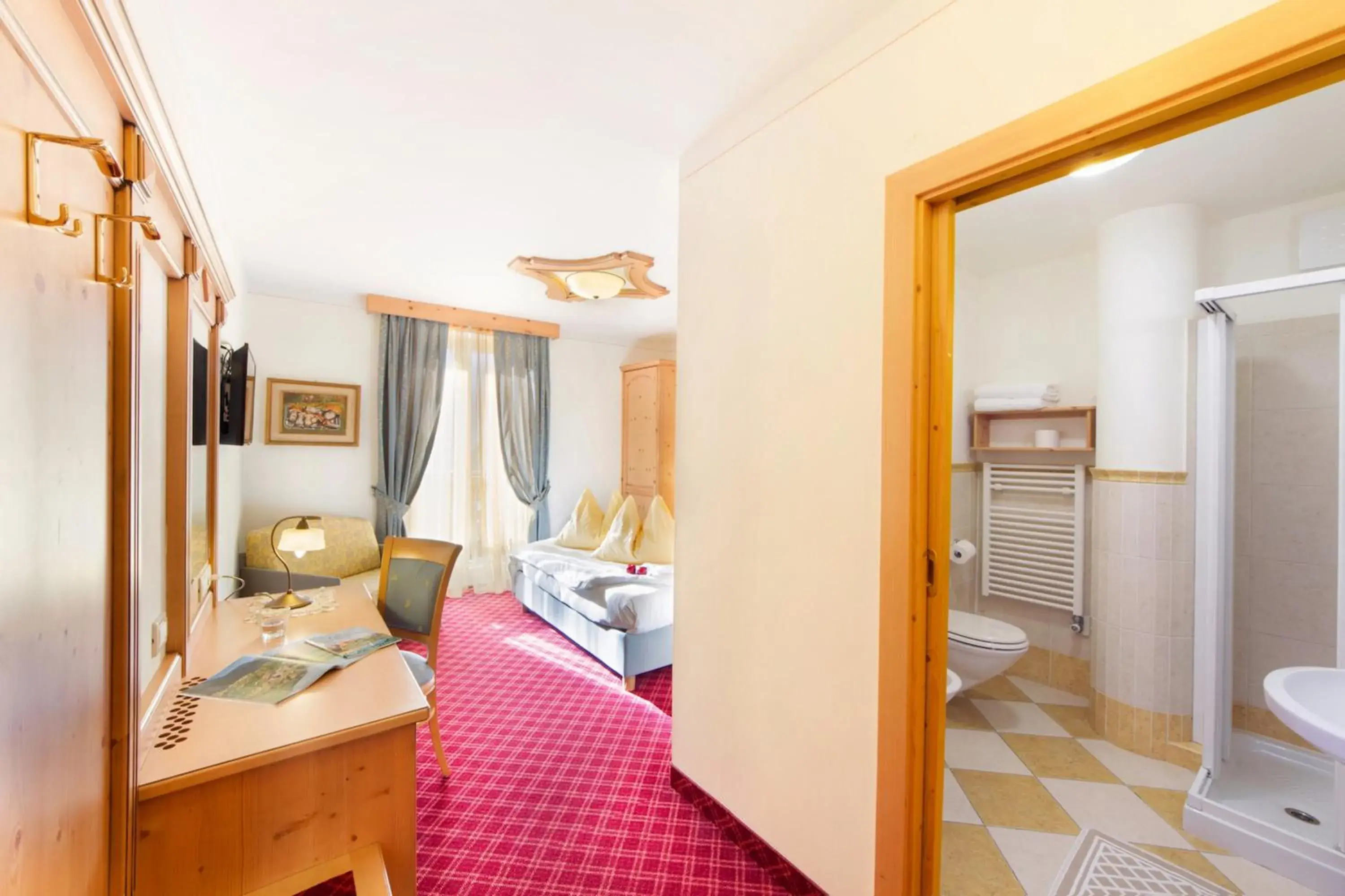 Comfort Triple Room with Lake View in Alpotel Dolomiten Comfort Triple Room with Lake View in Alpotel Dolomiten