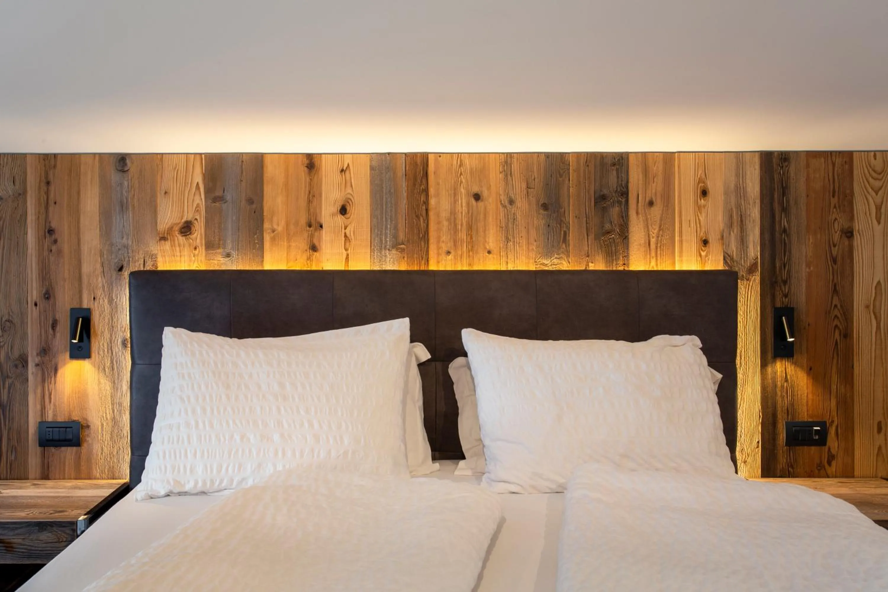 Bed in Alpotel Dolomiten