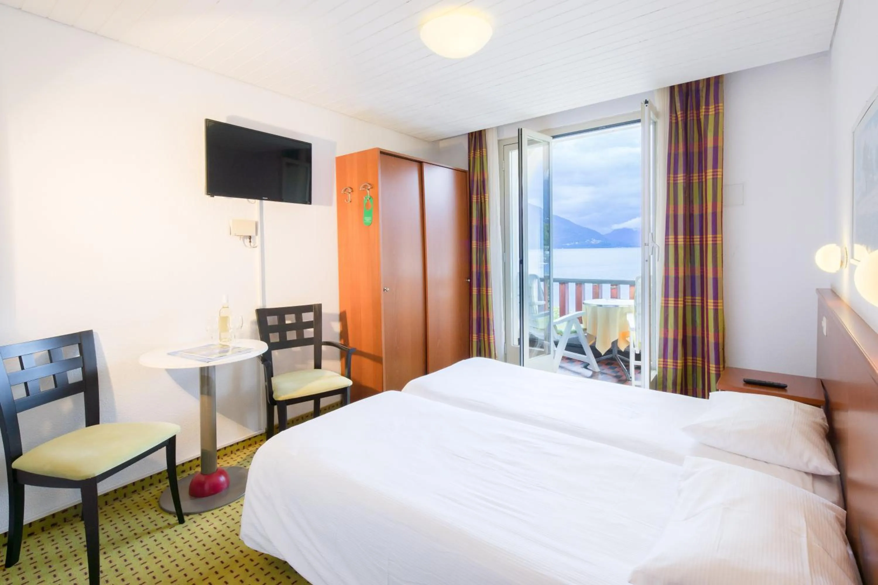 Photo of the whole room, Bed in Piazza Ascona Hotel & Restaurants