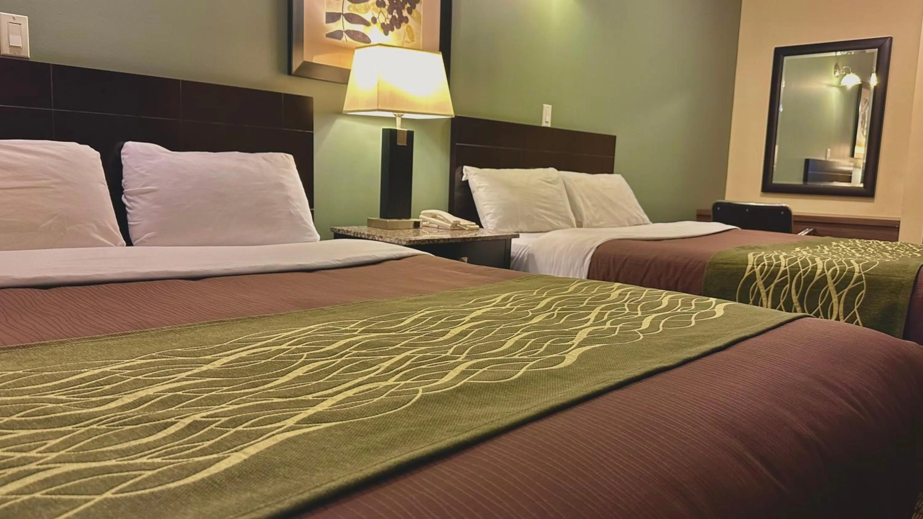 Bed in Lacombe Motor Inn