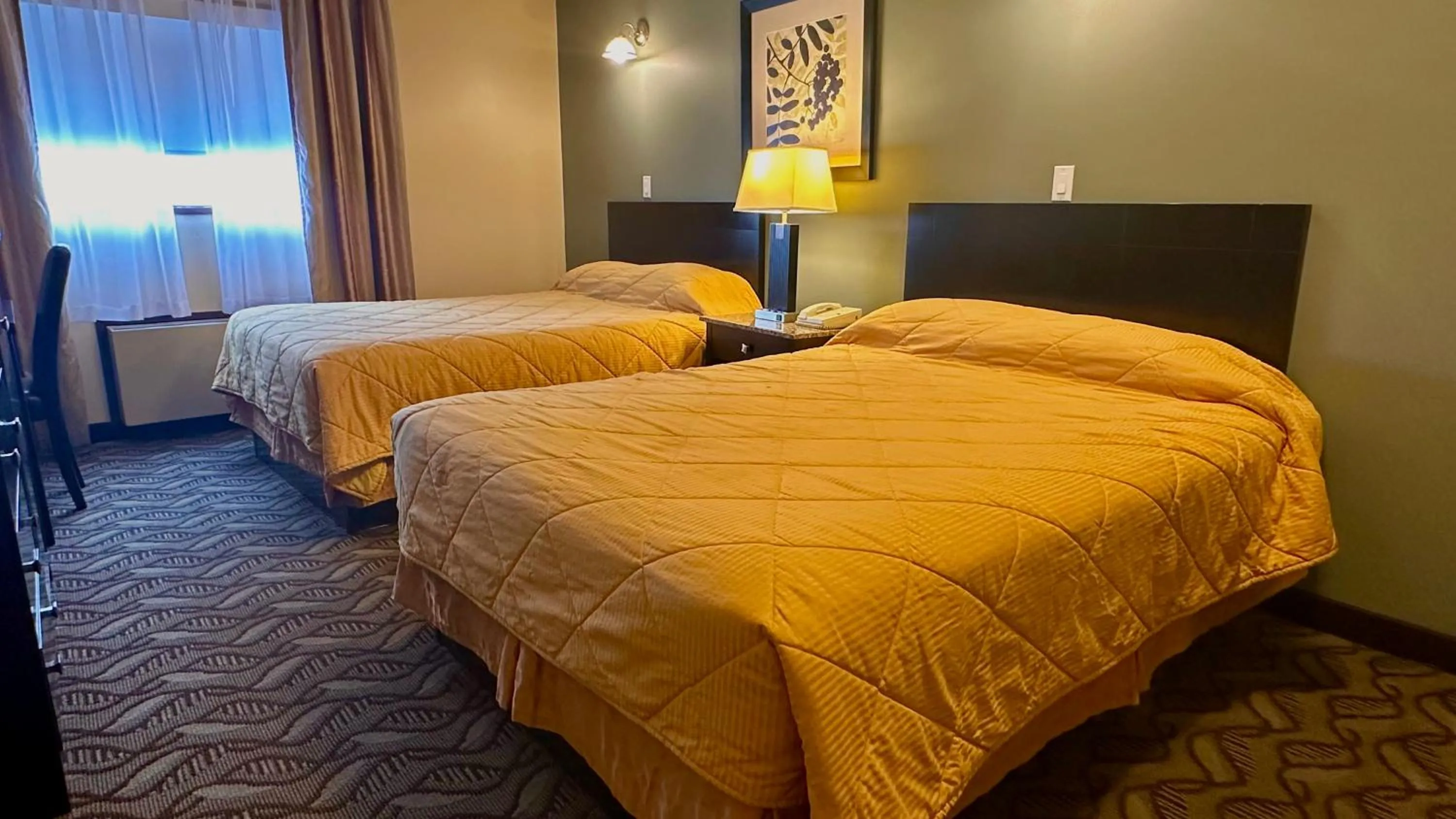 Bed in Lacombe Motor Inn