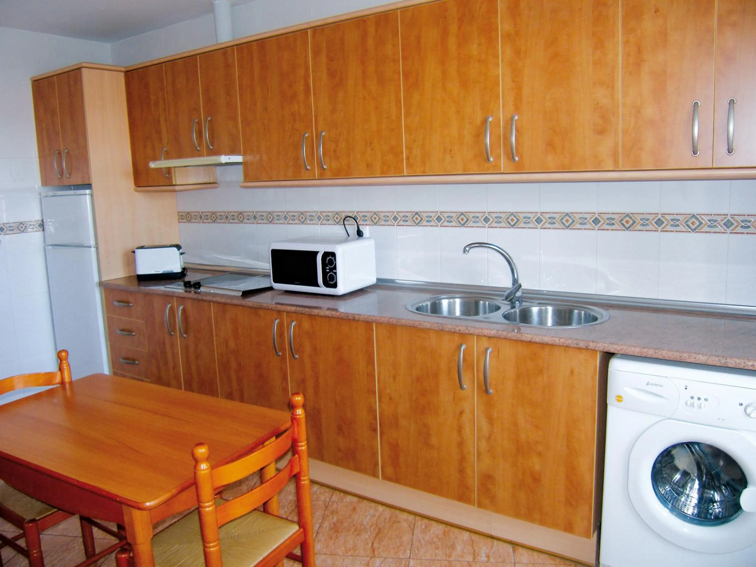 Kitchen or kitchenette in Apartamentos Maracay