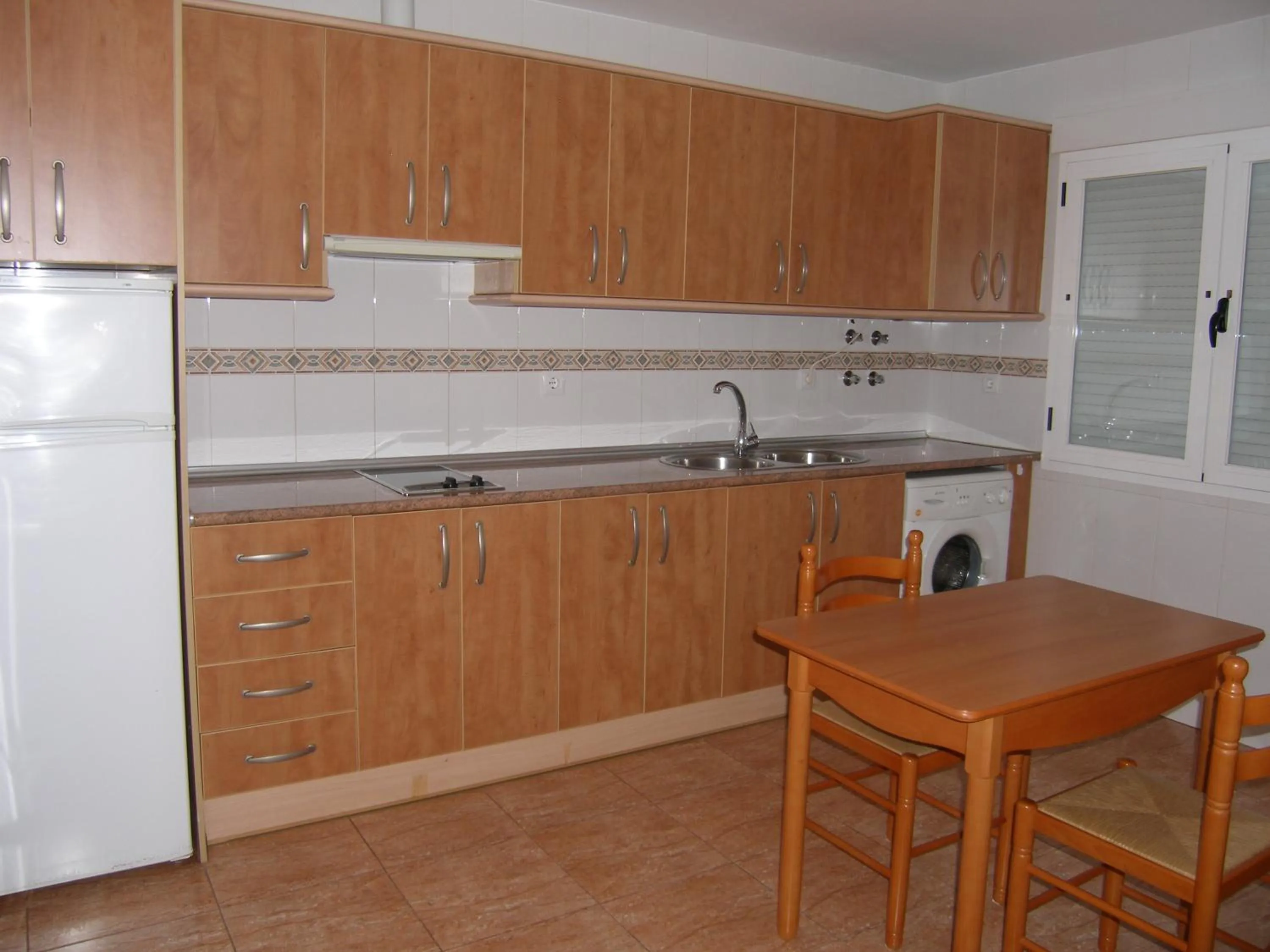 Kitchen or kitchenette in Apartamentos Maracay
