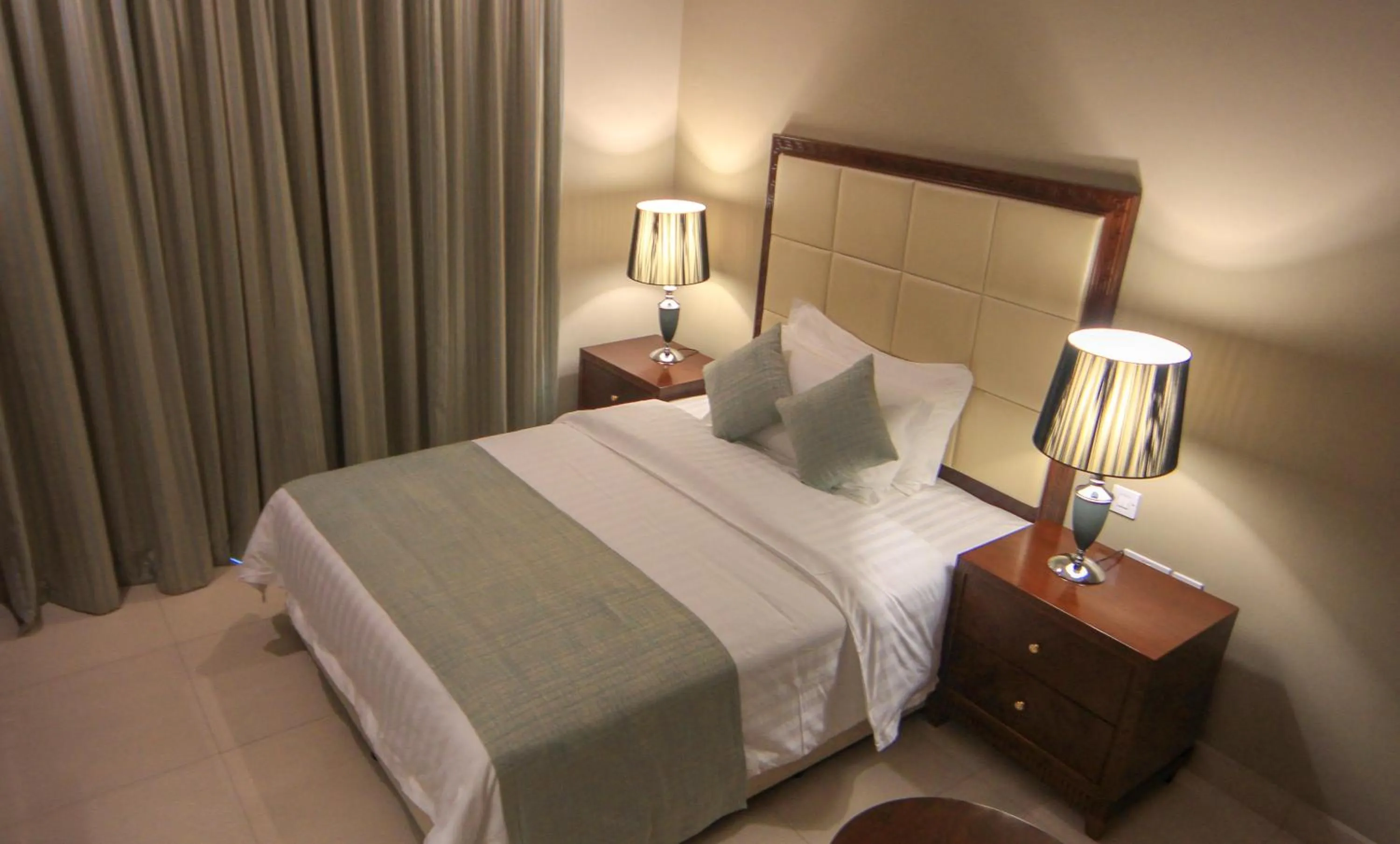 Bed in Muscat Inn Hotel